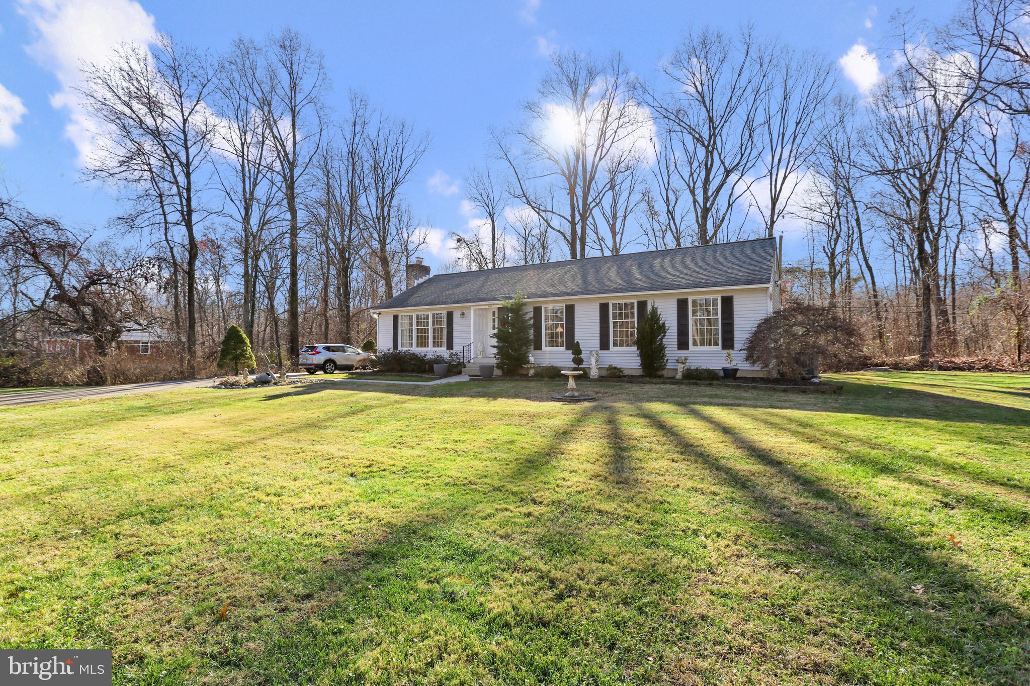 MULTIPLE OFFERS - OFFER DEADLINE SUNDAY 12/18 AT 12PM - OPEN HOUSE SATURDAY 12/17 FROM 11-1!  SPACIOUS WELL CARED FOR RANCHER ON QUIET DEAD END STREET BACKING TO LARGE BALTIMORE COUNTY WOODED PARCEL - this home features pride in ownership with over 2000 sq ft of open floor plan with luxury vinyl plank flooring throughout the main level, convenient main level owner suite with large connecting full bath and separate dining room leading to private rear deck, paver stone landscaping beds and paver stone driveway.  The finished lower level offers a 4th bedroom suite, large rec room with wood burning fireplace, separate laundry room with ample storage and welled walk out basement.  Recent updates include new carpet throughout, new hvac system and architectural shingle roof replaced in the last 3 years.  Sheds & gazebo sold as-is.