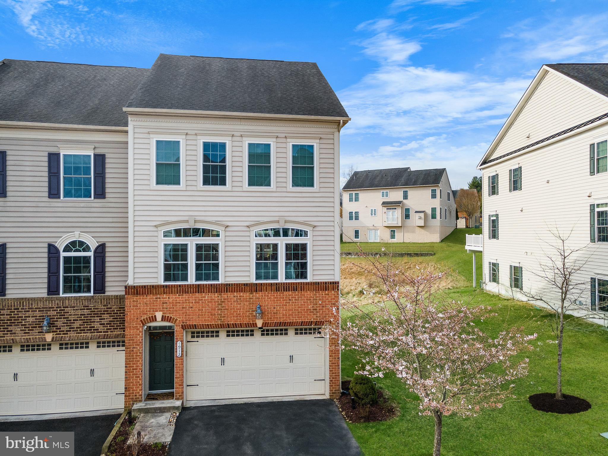 This stunning brick and vinyl-front, well-maintained end-of-row townhome showcases colonial-style architecture and expansive living space in a peaceful neighborhood. Spanning nearly 3,000 square feet, this home features 3 bedrooms, 3 full baths, 1 half bath, and a spacious 2-car garage.
The property is adorned with wood flooring throughout all three levels, except for two bedrooms and the stairs. Recent upgrades include a new refrigerator, water heater with expansion tank, sump pump, and AC compressor, ensuring modern efficiency and peace of mind. The townhome also boasts a magnificent gourmet kitchen with updated stainless steel appliances and enhanced space from recent renovations, making it ideal for culinary enthusiasts. The inviting living room provides the perfect space to unwind and enjoy TV time.
Outdoor living is a delight with a generously sized 20 x 15-foot deck, perfect for entertaining or relaxing. Just below, a matching 20 x 15-foot stone patio with a charming wall adds to the home’s outdoor appeal, creating the perfect setting for enjoying the fresh air in style.
A standout feature of this home is the impressive finished basement with soaring 13-foot ceilings, accommodating a beautiful home theater screen over 200 inches wide. Whether used as an entertainment area, home office, or guest suite, this versatile space is complete with custom built-ins, a full bath, and French doors leading to the backyard.
The second floor includes a convenient laundry area, streamlining household chores. The expansive primary suite offers a true sanctuary, featuring his and hers walk-in closets and an ensuite bathroom with double sinks for added comfort and luxury. Ample closet space throughout the home, coupled with additional storage in the garage, ensures all your storage needs are met.
Prepare to be captivated by this one-of-a-kind residence that seamlessly blends elegance, functionality, and modern updates to provide the perfect setting for a luxurious and comfortable lifestyle. Don't miss this extraordinary home!