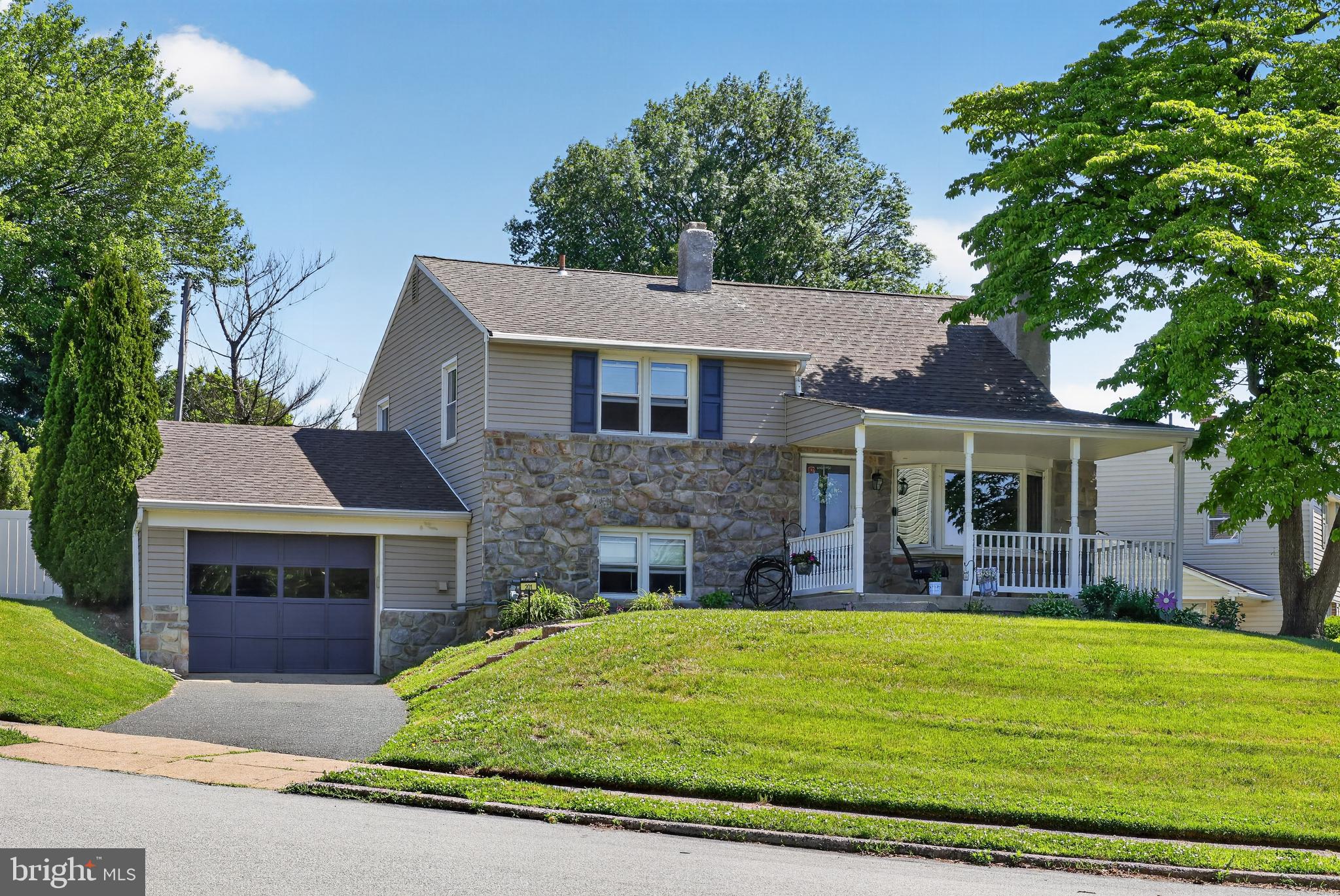 Welcome to this beautifully maintained and lovingly cared for home offering four levels of comfortable living space and an inviting in-ground pool. Combining timeless character with everyday functionality, this home provides the perfect setting for both relaxed family living and memorable entertaining.
From the moment you arrive, you'll appreciate the home's curb appeal, mature landscaping, and welcoming presence. Inside, warm wood laminate flooring, abundant natural light, and spacious rooms create an inviting atmosphere throughout. The living room serves as the heart of the home, showcasing a beautiful fireplace framed by custom built-in shelving and a large picture window that fills the space with natural sunlight. Whether hosting holiday gatherings or enjoying a quiet evening at home, this room offers comfort and charm in equal measure.
The eat-in kitchen provides abundant cabinetry, generous counter space, stainless steel appliances, and plenty of room for casual dining. Sliding glass doors lead directly to the rear deck, creating a seamless transition between indoor and outdoor living. Imagine enjoying your morning coffee overlooking the backyard, hosting summer cookouts, or gathering with family and friends while enjoying views of the pool and landscaped grounds.
With four levels of living space, this home offers flexibility to accommodate a variety of lifestyles. The upper levels feature generously sized bedrooms with ample closet space, including a spacious primary bedroom retreat. Additional bedrooms provide room for family, guests, home offices, fitness areas, or hobby spaces. The layout allows everyone to enjoy their own space while maintaining a warm sense of connection throughout the home.
Step outside and discover your own private backyard oasis. The in-ground pool serves as the centerpiece of this exceptional outdoor space, surrounded by attractive hardscaping, retaining walls, and mature landscaping that create both beauty and privacy. The concrete patio area provides the perfect vantage point for relaxing poolside, entertaining guests, or simply unwinding after a long day. Whether you're hosting summer celebrations, enjoying weekends with family, or spending quiet evenings outdoors, this backyard was designed to be enjoyed.
Additional highlights include ample storage throughout, neutral décor, updated fixtures, and a location that offers convenient access to shopping, dining, parks, schools, and major commuter routes. Enjoy being just minutes from  Linvilla Orchards & Indian Orchard Loop walking trail, Media's State Street, Chester Creek Trail, countless restaurants, shops, seasonal events, and vibrant atmospheres  that have made Media & Aston Township some  of Delaware County's most desirable destinations.
Offering the rare combination of generous living space, outdoor amenities, character, and location, this move-in-ready home presents an exceptional opportunity for its next owners.