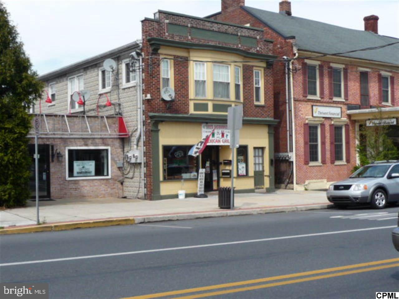 Good Main Street Location...Real Estate only. 4 units plus garage Includes: office, restaurant. Large 2 bedroom apt. Storage space. $30,000-$40,000 Gross income.