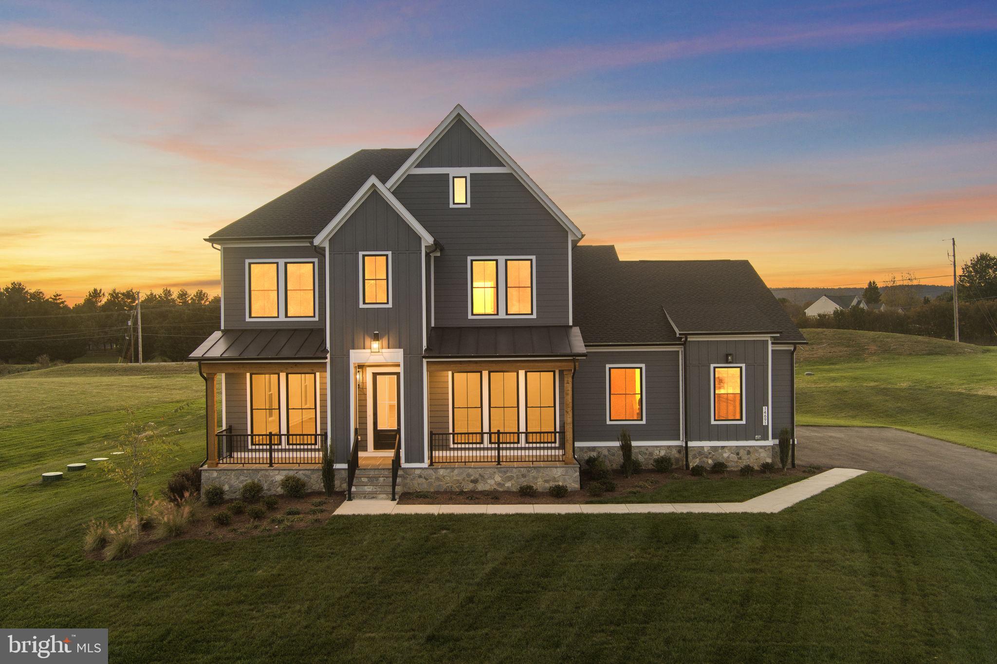 Seize the extraordinary opportunity to own this breathtaking home, nestled on a sprawling 3.0 -acre homesite! This brand new incredible SINGLE FAMILY HOME by Van Metre Homes at GLENMORE FARM is ready to move in IMMEDIATELY! Experience the height of luxury living with the TIMBERNECK III floorplan. Boasting 5,622 finished square feet on three levels, this exquisite residence offers 5 bedrooms, 4 full and 1 half bathrooms, and a 3-car garage, setting a new standard for sophisticated living. As you enter this beautiful abode, you are greeted by an expansive open floorplan under 10 ft. ceilings featuring an inviting great room with roaring fireplace, a private study, and distinct areas for living and dining—an entertainer's dream. The grandeur continues into the spacious gourmet kitchen complete with upgraded cabinets, quartz countertops, stainless-steel appliances, a walk-in pantry with solid shelving, a luxurious culinary kitchen wet bar, and an inviting eat-in breakfast room. The upper level is a sanctuary of its own, showcasing an impressive primary suite with a large walk-in closet and a lavish 5-piece bathroom, complete with double sinks, an oversized shower with a built-in seat, and a dramatic freestanding tub. Three additional secondary bedrooms, two full baths, and a convenient upstairs laundry room add to the allure. But that is not all! The basement level provides a large rec room, additional bedroom, and full bathroom providing additional space to complement your lifestyle. Being a new build, your home is constructed to the highest energy efficiency standards, comes with a post-settlement warranty, and has never been lived in before! Elevate your lifestyle in this meticulously crafted home that seamlessly blends elegance with functionality, providing an unparalleled living experience for those who seek the finest in every detail. Schedule an appointment today! ----- Discover Glenmore Farm, a Van Metre single family home neighborhood destined to become a premier community in the Loudoun Valley area. Offering a distinct small-town feel and access to excellent schools, Glenmore Farm is designed for everyone. Nestled in the bucolic countryside of western Loudoun County, the neighborhood boasts 3+ acre homesites with spacious homes, grand porches, and sweeping views of the Blue Ridge mountains. Just minutes from Waterford and downtown Purcellville, residents enjoy the tranquil ambiance and picturesque surroundings. Glenmore Farm ensures a seamless blend of modern amenities and country living, making it a truly desirable place to call home. -----Take advantage of closing cost assistance by choosing Intercoastal Mortgage and Walker Title. ----- Other homes sites and delivery dates may be available. ----- Pricing, incentives, and homesite availability are subject to change. Photos are used for illustrative purposes only. For details, please consult the Sales team.