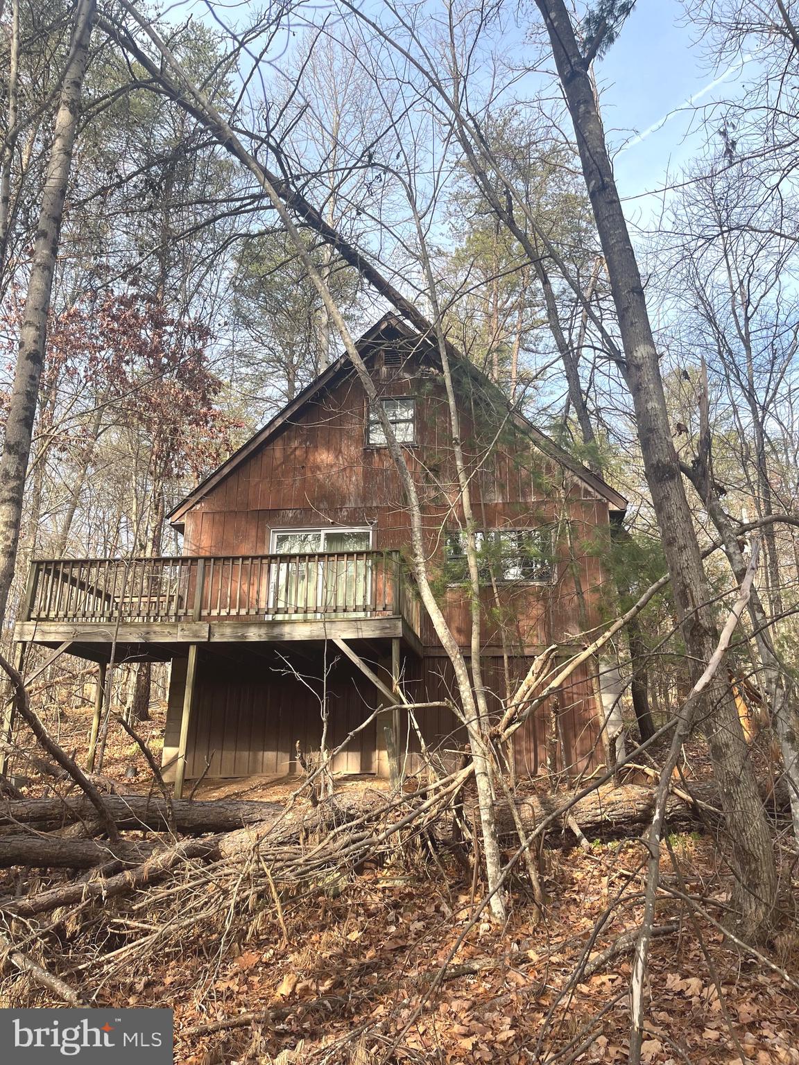 Fixer upper!! Sold as is, buyer to do due diligence. Settlement to happen after probate is completed.  2BR 1BA Cabin located on 3.16 acres in Berkeley Springs. Cabin needs rehab to make habitable. Once renovated, would be perfect getaway, airbnb or even full time residence.
