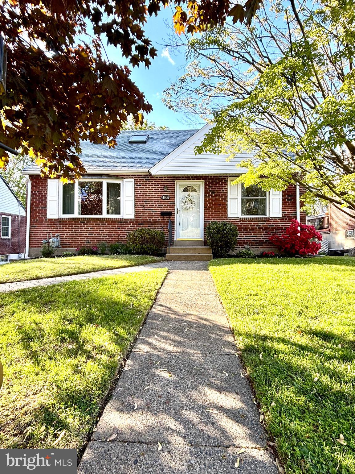 A rare offering! This exceptionally clean brick Cape Colonial, located in the Leedom Estates neighborhood of Haverford Township will not last.  With 3 spacious bedrooms (one on the 1st floor), this home offers the versatile features of both a ranch and a colonial style house and is just the right size for everything you need!  The 1st floor living room and dining room are freshly painted with beautiful gleaming hardwood floors, and bright with natural sunlight.  An updated kitchen with new appliances,  large bedroom,  stall shower bath and sunroom complete the floor plan.  Upstairs, there are 2  additional bedrooms and a hall bath.  The lower level is partially finished as a family room, and storage area with powder room, laundry and exit to rear drive and one car attached garage.  A spacious tech deck expands your outdoor living area and overlooks the rear yard.  Numerous newer features include replacement windows, roof, hot water heater, and  deck and ensure worry free living for years to come!