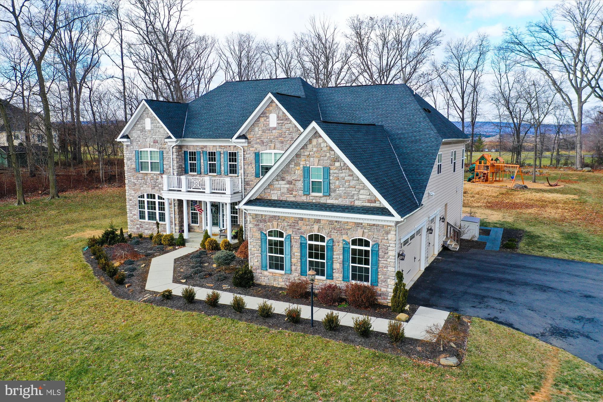 Welcome to this exquisite 7,252 sq. ft. home with two levels plus a finished basement, nestled on 3.4 acres of lush, private land, offering breathtaking views of the mountains right from the front of the house. Where luxury, style, and comfort converge, this pristine residence features 5 spacious bedrooms, 5 full baths, 1/2 bath, and a host of exceptional features, perfect for both relaxing and entertaining. Step inside to discover an expansive open floor plan designed for modern living. The heart of the home is the epicurean kitchen, a culinary masterpiece featuring high-end appliances, a large island, custom cabinetry, and beautiful finishes. Adjacent to the kitchen is a cozy dining area and a bright living room, both providing the perfect setting for hosting guests or enjoying quiet moments. On this level, you'll find 1 bedroom, 1 full bath, and a convenient half bath. This level also has radiant heat floors thoughout, The upper level boasts a spacious owner's suite, complete with a luxurious en-suite bath, ample closet space, and a gas fireplace, creating the perfect ambiance for relaxation. In addition to the owner's suite, there are 3 generously sized bedrooms, perfect for family or guests. A bonus room on this level provides additional space that can be customized to suit your needs, whether as an office, playroom, or media space. The fully finished lower level is an entertainer’s paradise. Room for a pool table, air hockey, and ping pong table in the game area. For movie lovers, there is a  theater room waiting for your personal touches. Fitness enthusiasts will appreciate the exercise room, and a bonus room offers additional flexibility for various needs. The partial kitchen adds convenience for entertaining, while the full bath and walk-out basement provide easy access to the backyard for outdoor enjoyment. Welcom Home!