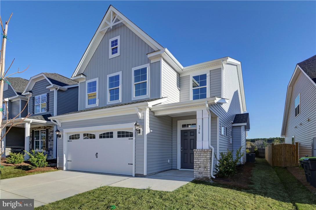 Hickory Grove is a new 55+ community in Ashland offering first-floor primary suite floor plans for comfortable, low-maintenance living.  The Edinburg offers four bedrooms, 3.5 baths, and a two-car front-load garage. The kitchen features a wide island, a walk-in pantry, and a separate cafe area. The spacious and open family room is open to the kitchen and cafe area. Tucked on the back of the home is the FIRST-FLOOR PRIMARY SUITE with a large walk-in closet and an ensuite bath featuring a walk-in shower and a double vanity. A convenient powder room for guests and a laundry room complete the first floor. The second floor features three spacious bedrooms, all with walk-in closets. Bedroom two has direct access to a full hall bath, while bedrooms three and four share a Jack-&-Jill bath with separate vanities. An oversized open loft area completes the second floor. Options available to personalize this home include an optional island layout in the kitchen, several primary bath layouts, a garage storage area, and a covered porch or screen porch. Lawn maintenance, irrigation, and trash are all handled by the HOA, giving you more time for the moments that matter most. Community amenities include walking trails, a dog park, a pond with a pier, pickleball, a community garden, a gazebo, and a fire pit. The neighborhood features spacious, open-concept designs with top-quality craftsmanship. Residents enjoy close proximity to downtown Ashland, dining, shopping, healthcare, and major routes like I-95 and Route 1. Hickory Grove provides the ideal setting to relax, connect, and embrace your next chapter.