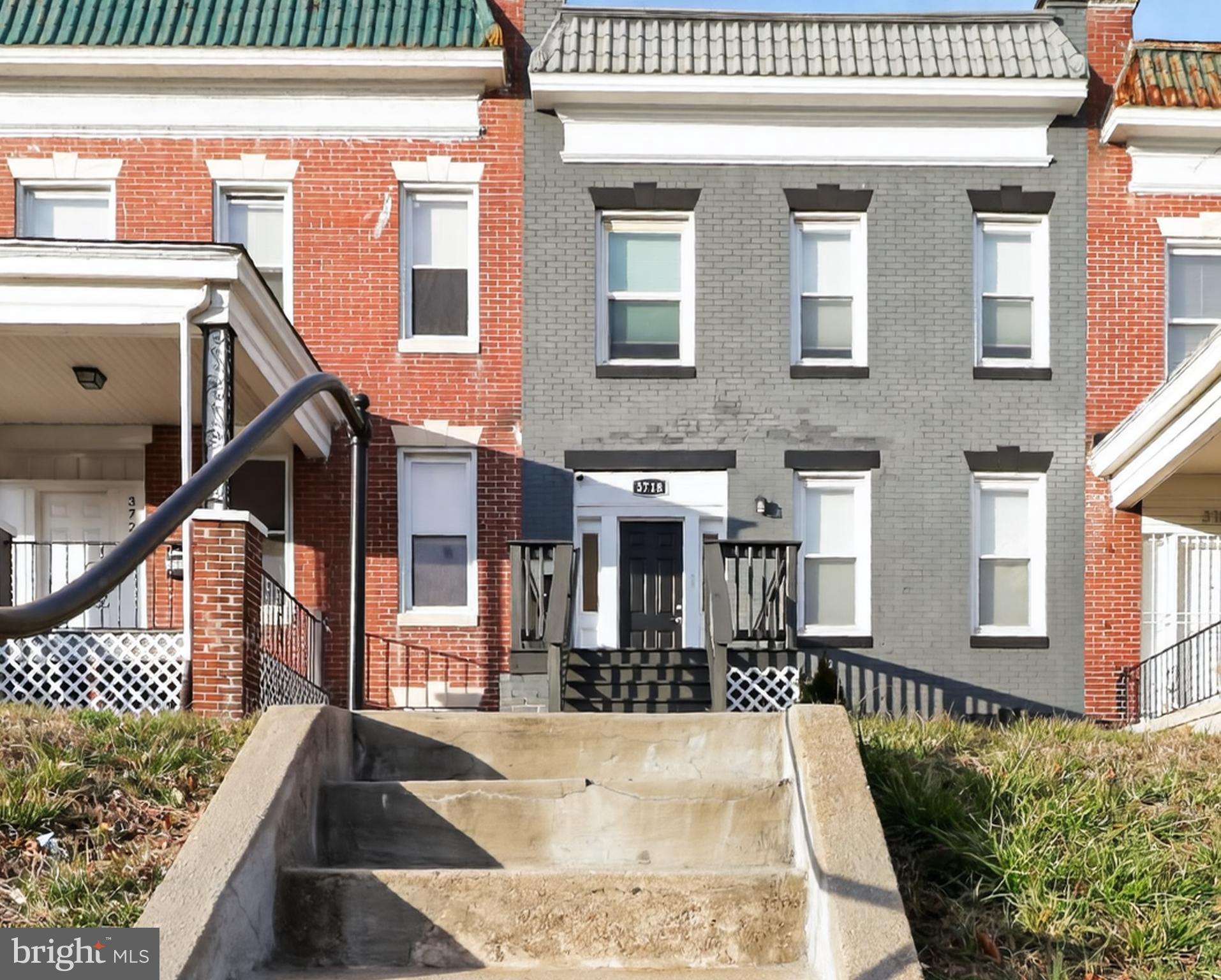 Welcome to this beautifully updated 4-bedroom, 2.5-bath townhome in the heart of Edmondson Village, complete with a convenient off-street parking pad at the rear. The thoughtfully designed main level offers an open and welcoming layout highlighted by fresh paint, updated flooring, recessed lighting, and a built-in coat nook that adds both style and function. At the heart of the home, a chef’s kitchen shines with white shaker cabinetry, a classic subway tile backsplash, stainless steel appliances, and a generous island with pendant lighting and bar seating, making it perfect for enjoying your morning coffee. The adjacent dining area flows seamlessly into the spacious living room, creating an ideal setting for entertaining. A conveniently located powder room and laundry area complete the main level, rounding out a layout that is as practical as it is inviting. Upstairs, the owner’s suite serves as a relaxing retreat with a fully remodeled en-suite bath featuring a tiled tub/shower. Three additional bedrooms and an updated hallway bath provide plenty of space for family, guests, or an in-home office. The large unfinished basement offers tons of space for all your storage needs and the opportunity to finish and add more finished square footage with your own future customizations. The rear of the home provides a private parking pad with convenient access to the home. This move-in-ready home features recently updated major systems, including HVAC, plumbing, electrical, roof, and new windows, all installed in 2021, along with a new water heater installed in 2024. Ideally located within 1.5 miles of the West Baltimore MARC station and offering easy access to BWI Airport, I-695, and the Inner Harbor, this home puts dining, shopping, and entertainment within reach. Don’t miss this incredible opportunity!