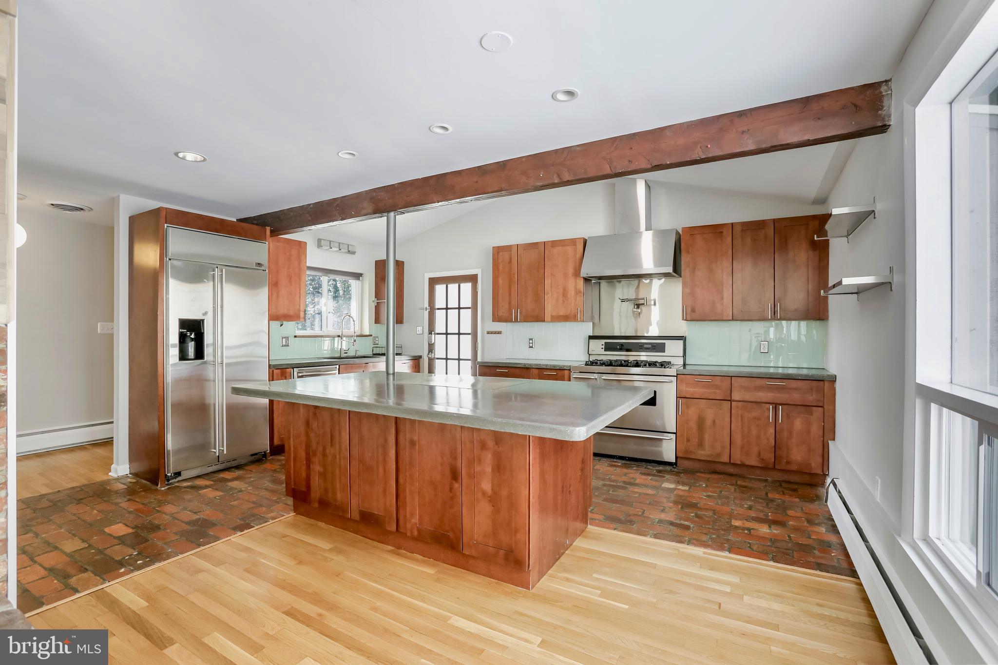 A Hickory Hall beast!  Situated on a massive lot spanning over half an acre, this brick rambler is spacious and stylish.  The main level features a chef's kitchen with a hibachi grill, and an inviting living area with a showstopping fireplace.  The fully finished lower level gives you tons of options with additional bedrooms, bathroom, and living space.  Freshly painted throughout, with refinished hardwood floors on the main level.  Perfect for relaxing, entertaining, and whatever else you might fancy- this oasis is calling your name.