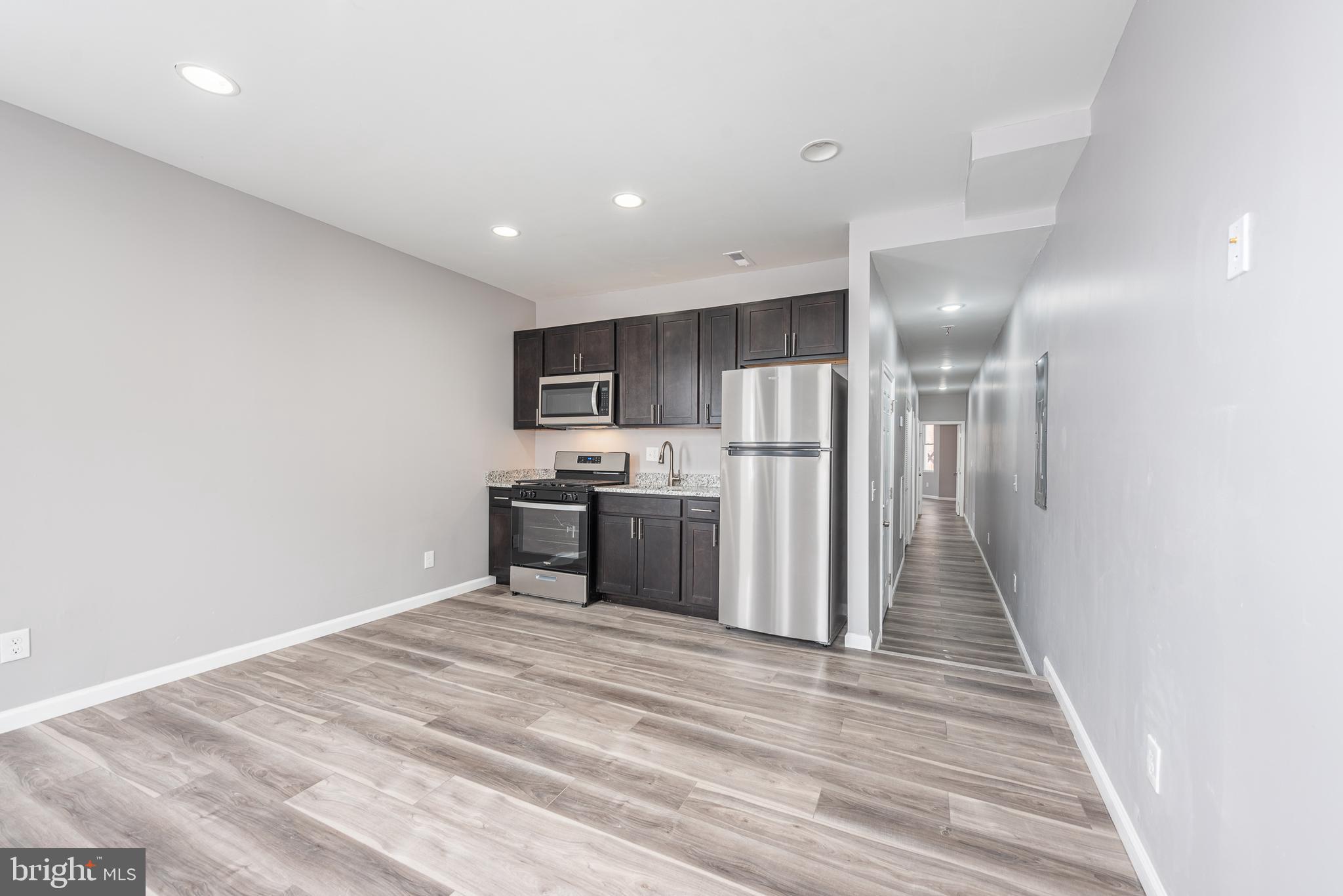 SPACIOUS NEWLY RENOVATED 2 BEDROOM APARTMENT LOCATED IN A CONVENIENT LOCATION!  This unit is approximately 915 sq. ft. and features new laminate wood flooring throughout, a spacious living room, updated kitchen with new ss appliances & granite counters, 2 large bedrooms, 1 full bath, and in unit laundry!  MINIMUM CREDIT SCORE OF 620 REQUIRED TO BE CONSIDERED WITH NO HISTORY OF EVICTIONS