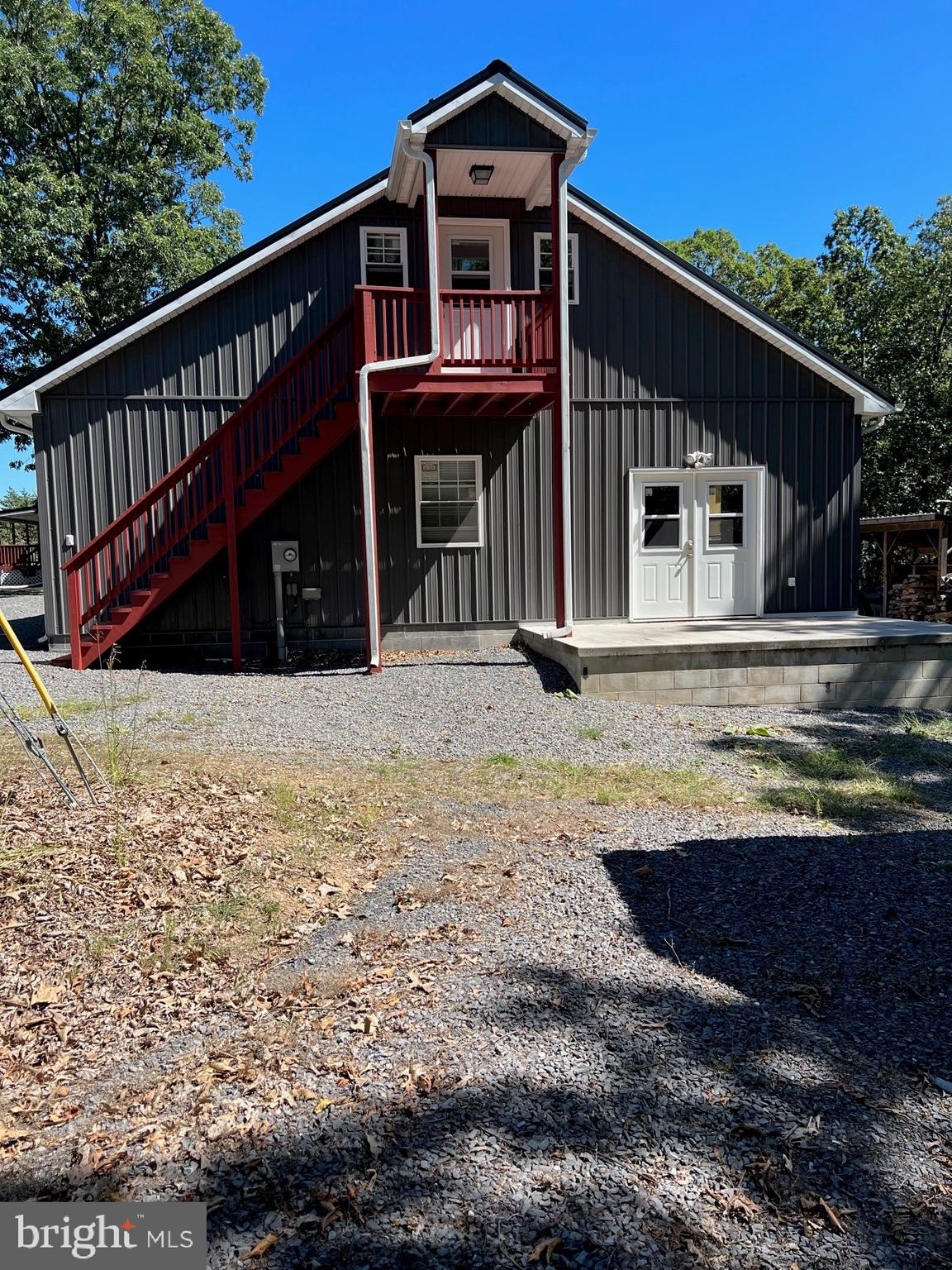 Beautiful 3BR 2BA home with breathtaking views on 26.99 unrestricted acres! Minutes from Corridor H. Nice amenities, in like-new condition!  Hot Tub on deck. near living area.  Amazing garage apartment over a three bay garage built in 2015 with 10 ft. ceilings and includes central air and heating. Two sources of heat. wood furnace and propane (tank is owned) for both home and garage/apt.  Generac 17K generator for home and garage/garage apt.  All appliances convey including washer and dryer.  50 x 22 ft. canopy garage. Over 100 Christmas Trees on this property.  Must see to appreciate the beauty and opportunities!
