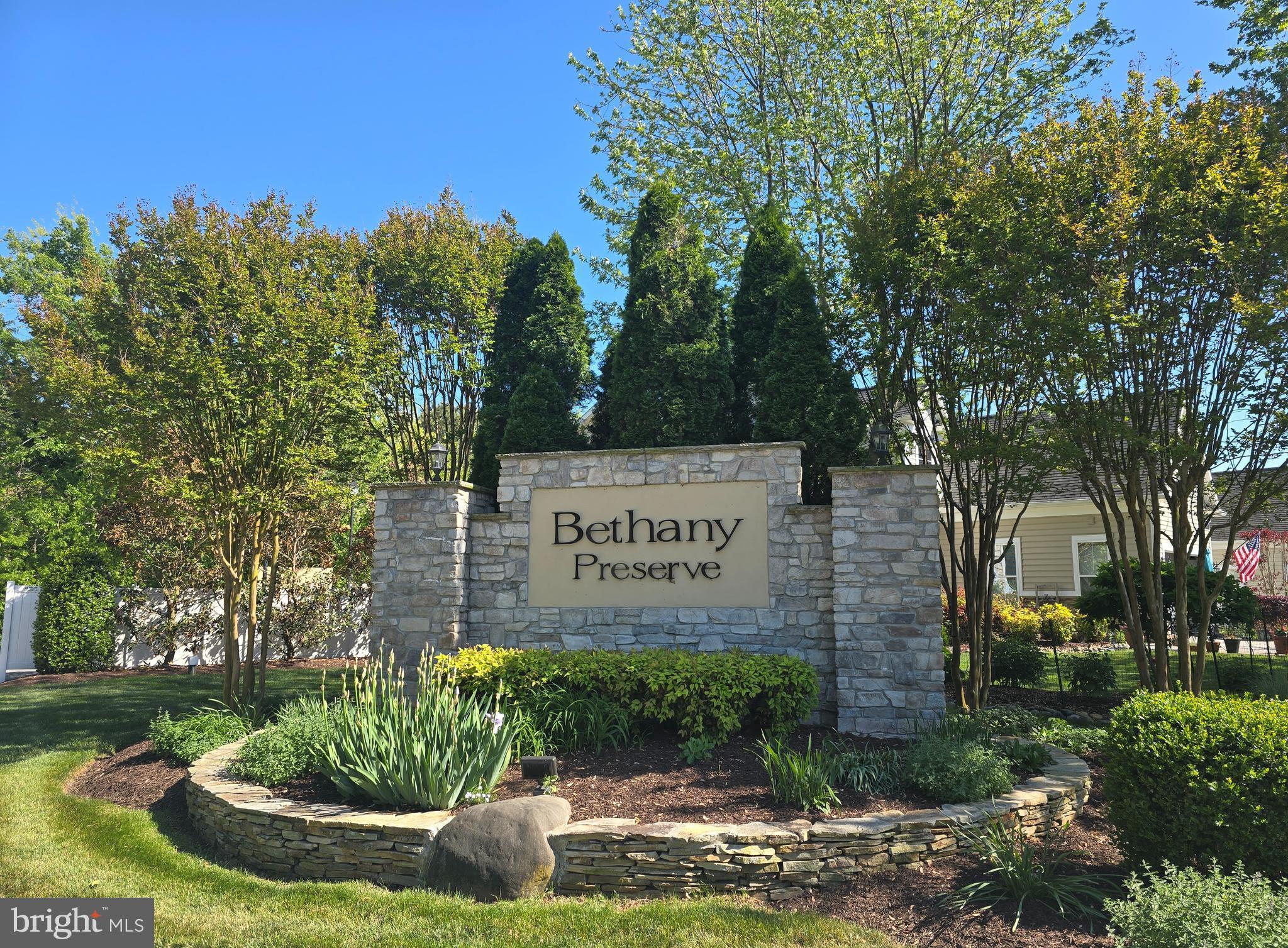 NEW PRICE!  Experience exceptional coastal living in this beautifully maintained, never-rented home offering over 3,100 square feet of thoughtfully designed space in the desirable Bethany Preserve Community--one of Ocean View's hidden gems.  Perfectly positioned on the largest lot in a quiet corner of the neighborhood, this home delivers rare privacy with serene pond and wooded views, all just LESS THAN 2 MILES FROM BETHANY BEACH, and steps from Fresh Pond Park's walking and biking trails.  This is where beach access meets everyday tranquility.  Major updates provide true peace of mind, including  BRAND NEW ROOF AND HVAC SYSTEM (2025) ALONG WITH UPGRADED APPLIANCES--refrigerator, dishwasher, microwave and washer--allowing you to move in with confidence and ease.  FLOOD INSURANCE IS NOT REQUIRED, adding to long-term affordability and simplicity.  Inside, a light-filled open-concept design is anchored by rich hardwood flooring and a chef-inspired kitchen featuring granite countertops, stainless steel appliances, double ovens, a gas cooktop, and a spacious pantry--ideal for both entertaining and everyday living.  The main-level primary suite is a private retreat, complete with a sitting area, dual closets (one walk-in), and a large spa-style bath designed for relaxation.  Step into the bright three season sunroom and out onto the deck, overlooking the peaceful pond and fountain.  A flexible bonus room offers space for a home office, guest suite, or media room, while additional features include a two-car garage, irrigation system, and encapsulated crawlspace for enhanced efficiency and comfort.  Residents of this intimate community enjoy a private pool and pool house and easy access to five miles of hiking and biking trails within Fresh Pond State Park just down the street, completing a resort-style coastal experience.  This is more than a home--it's a turnkey beach retreat in one of Delaware's most desirable locations.  This is also a foodie’s dream location. You are just minutes from a grocery store and the area’s best restaurants. Start your morning at Drifting Grounds,  grab a bite at Honey’s Farm Fresh, or indulge in coastal classics at Northeast Seafood Kitchen and other restaurants.  Everything you crave is within few minutes. Move-in ready and priced to sell. PARTIALLY FURNISHED - additional furniture negotiable under separate agreement with acceptable offer.