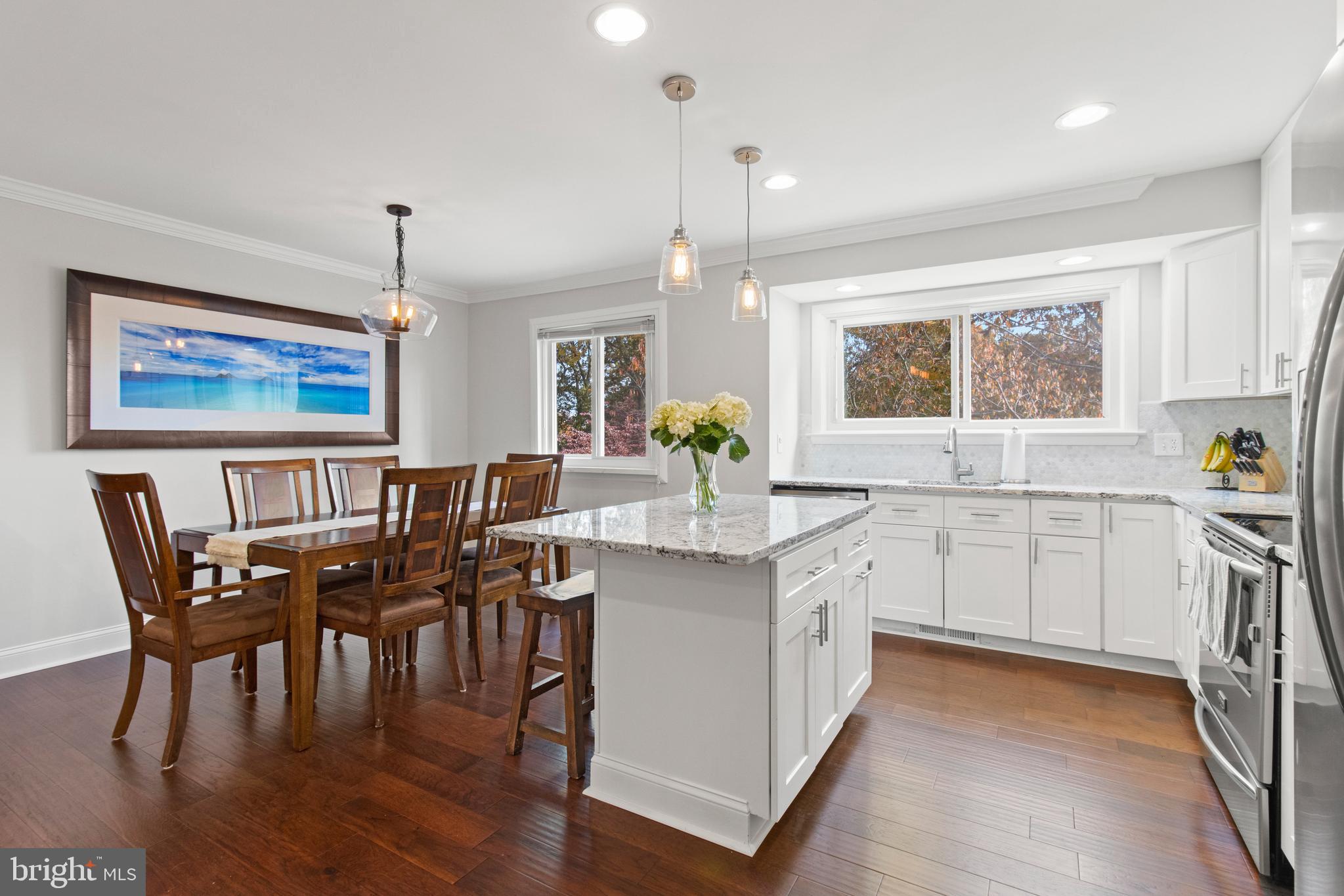 Professional Photos and video just added-OPEN Sunday 11/14 10-1 . Come visit this remodeled top to bottom in 2016,  sassy split styling with walls removed to showcase this gorgeous kitchen as the central hub where everyone will want to be. The outside is deceivingly plain so plan to be blown away when you enter. White 42" cabinetry, subway title backsplash, stainless steel appliances , granite counters and an nice granite island for extra work space or a place to eat under pendant lighting.  Recessed lighting and cool fixtures add to the natural light. 
Seller took out small 3rd bedroom  upstairs and made an amazing Master suite with a California Closet organized walk-in closet.  Doors have been replaced with two panel doors and all floors have been replaced with pre-manufactured hardwood last week. The tax record is wrong as it is larger than listed as the lower level has two rooms that could be an office/den/2 more bedrooms and another full bath for ease of living or for guests and an additional bonus room off the lower family room. The family room features a white brick fireplace pellet stove with mantle and is bright and cheery. Front foot has been paid off. Seller installed Phelps water conditioning system which is owned. Windows were replaced by Thompson Creek in 2018 and come to buyer with a transferrable warranty. 5 ceiling fans.
Cape Saint Claire has a $10/year mandatory HOA fee and a special tax district to enjoy 5 beaches and boat access, playground, pool, ball fields, social activities and a great community shopping center and walking access to the Broadneck Trail and Broadneck Park with Dog Park and Hooking into B&A Bike Trail. Easy access to 50, NSA, Naval Academy, Baltimore and DC with great Broadneck schools.
Seller painting and doing last minute adjustments and should be ready for professional photos and listing the second week of November. Seller has found home of choice and would like to  settle and rent back until mid January.