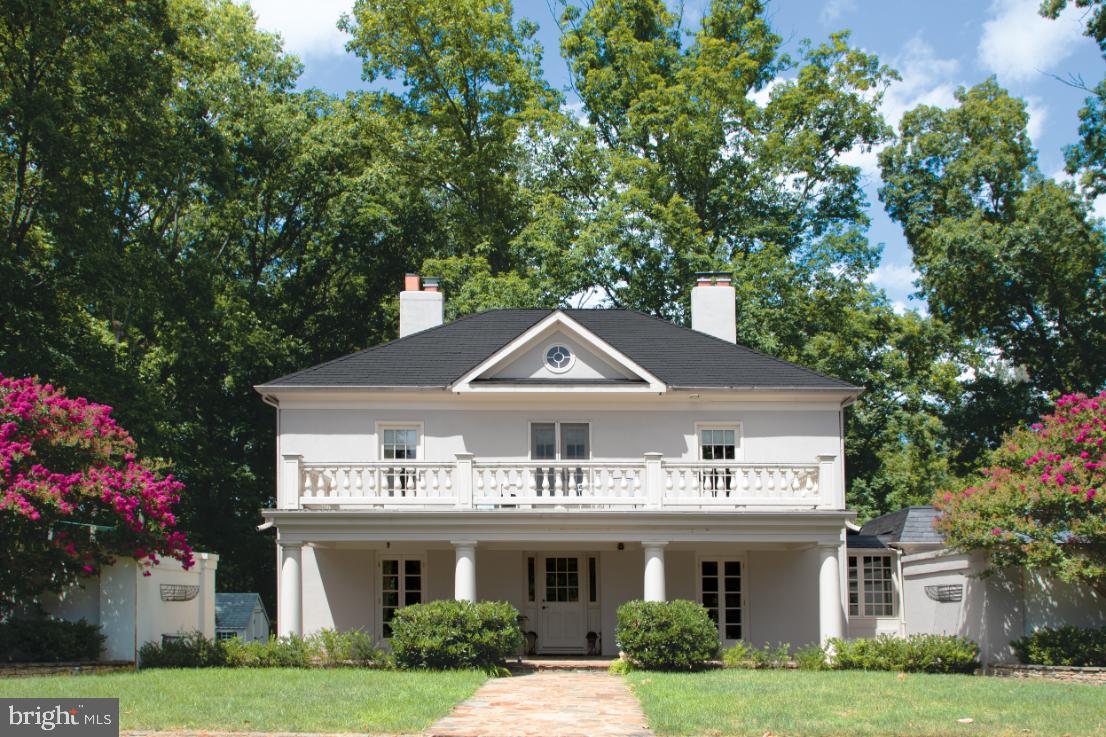 MAGNOLIA FARM -Within minutes of historic Middleburg, the private lane of Burrland is home to some of the finest hunt country estates in the area, most protected by Conservation Easements. 
This very manageable 13+ acre estate features the manor home with a first-floor bedroom and 3 additional bedrooms on the second level. Beyond the home is a stable with 3 nicely finished stalls and 2 separate offices. Opposite the stable is a stunning 1 bedroom apartment featuring high ceilings, kitchen, and full bath. Attached to the apartment is a one car garage/equipment barn.

This property exudes old world charm. Stone posts mark the entrance to the home and a second driveway provides a more direct access to the barns. The manor home is set well off of the road and features a front courtyard and a covered front entry providing a very welcoming feel. Stone terraces and stone walled courtyards create wonderful areas to relax, dine and entertain.

MAIN LEVEL: The travertine floored foyer opens to the left into the library, to the right into the  dining room and straight ahead into the living room. The living room then opens to the family room and kitchen. From the living room and family room French doors open out to a spacious stone terrace, gardens and back yard.  From the dining room one can enter the breakfast area of the kitchen, and a hallway which leads to a full bath and main level bedroom. This hallway also has access to the back terrace. From almost every room on the main level one has access to an outside terrace or courtyard making this a wonderful country home.

UPPER LEVEL: This level features three bedrooms and two full baths. The primary bedroom with private bath and walk-in closet is on the front of the home and has French doors which open to a private deck. Two additional bedrooms on this level share the hall bath. One of the bedrooms is a charming two-level suite with the cozy upper level room having dormer windows.

LOWER LEVEL: From the family room, steps lead down to a finished game room, laundry room and furnace room with water filtration system, on demand hot water heater and oil furnace.

HORSE FACILITIES: Magnolia Farm is in prime Orange County Hunt Territory where the ride-out has potential to be spectacular. The three stalls are in a barn attached to 2 separate office spaces. To the front of the property there is a large board fenced field.