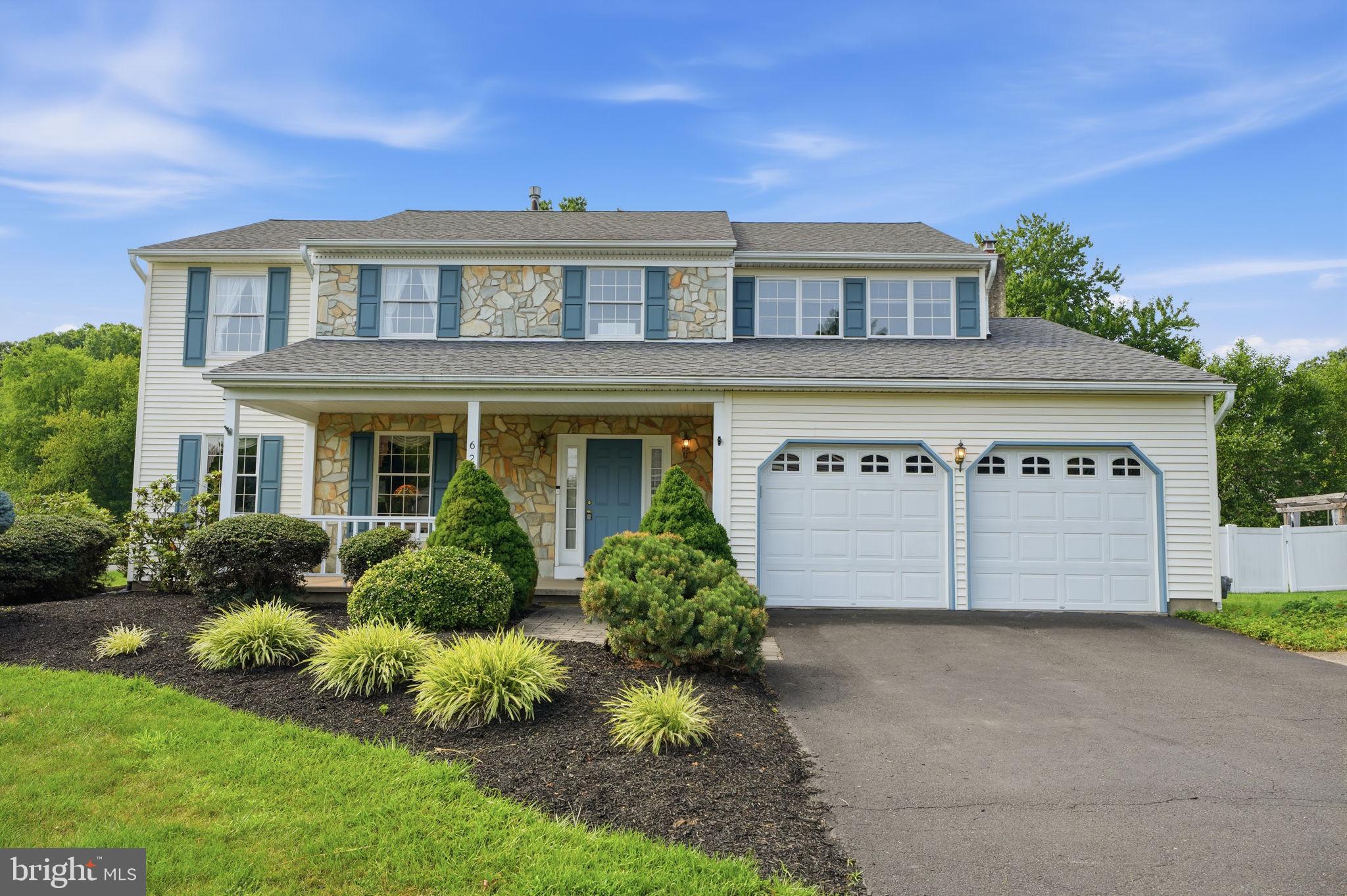 Welcome to 625 Teich Drive, situated on a beautifully landscaped corner lot in the highly desirable Wynnewood neighborhood of Lower Makefield Township, within the award-winning Pennsbury School District. Timeless curb appeal, mature landscaping, and meticulous upkeep create a memorable first impression of this exceptional residence.
Step inside to a spacious foyer where gleaming hardwood floors create a warm and elegant first impression. The expansive living room offers an inviting space for gathering with family and friends and flows seamlessly into the formal dining room with picturesque views of the backyard.
The beautifully updated eat-in kitchen features white cabinetry, granite countertops, a stylish tile backsplash, stainless steel appliances, a large pantry, and a bright bay window that fills the space with natural light. Just off the kitchen, the inviting family room showcases a stunning floor-to-ceiling stone wood-burning fireplace, elegant wainscoting, chair rail molding, a coffered ceiling, and sliding glass doors that lead to a spacious deck—perfect for entertaining or relaxing while enjoying the peaceful surroundings. Completing the main level are a convenient powder room, laundry room with additional storage, access to the side yard, and entry into the attached two-car garage. Upstairs, the expansive primary suite serves as a private retreat, offering a large walk-in closet, a dedicated dressing area with vanity, a linen closet, and a private en-suite bathroom. A unique sitting area overlooking the hall and foyer, complete with a charming Juliette balcony, provides the perfect space for a home office, reading nook, or lounge. Three additional generously sized bedrooms each offer ample closet space and share a well-appointed hall bathroom featuring double vanities and a linen closet. The finished basement provides valuable additional living space, ideal for a media room, home gym, playroom, or recreation area. A separate workshop and utility room offer excellent storage and functionality. Conveniently located near major highways, train stations, shopping, restaurants, and parks, this exceptional home combines space, comfort, and timeless style in one of Lower Makefield’s most sought-after neighborhoods. Don’t miss the opportunity to make this beautifully maintained home your own!