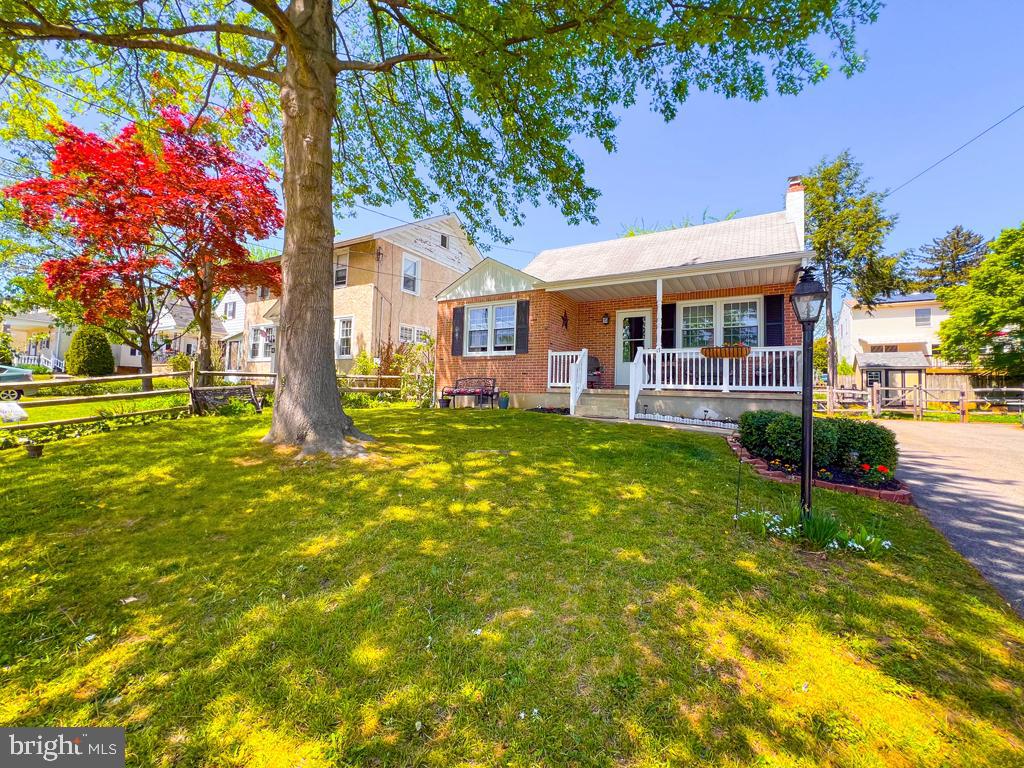 Welcome to this super cute cape cod located in the very desireable Springfield Twp School District.   As you walk up to the home you will notice the pride of ownership.  You will see a covered porch with furniture and beautifully painted front door.  As you enter the the living room you will notice the original hardwood floors which to left leads to the dining area, steps leading upstairs to 2nd floor, and kitchen with exit to yard.  Through the living room you find 2 bedrooms, full bathroom, and steps that lead to the basement. The basement has a laundry area with storage and finished area which could serve as a very nice sized family room.  On the second floor there is orignial hardwood floors as well with 2 bedrooms and another full bathroom.   There is a yard with a storage Shed and a shared driveway on the side of the home.
