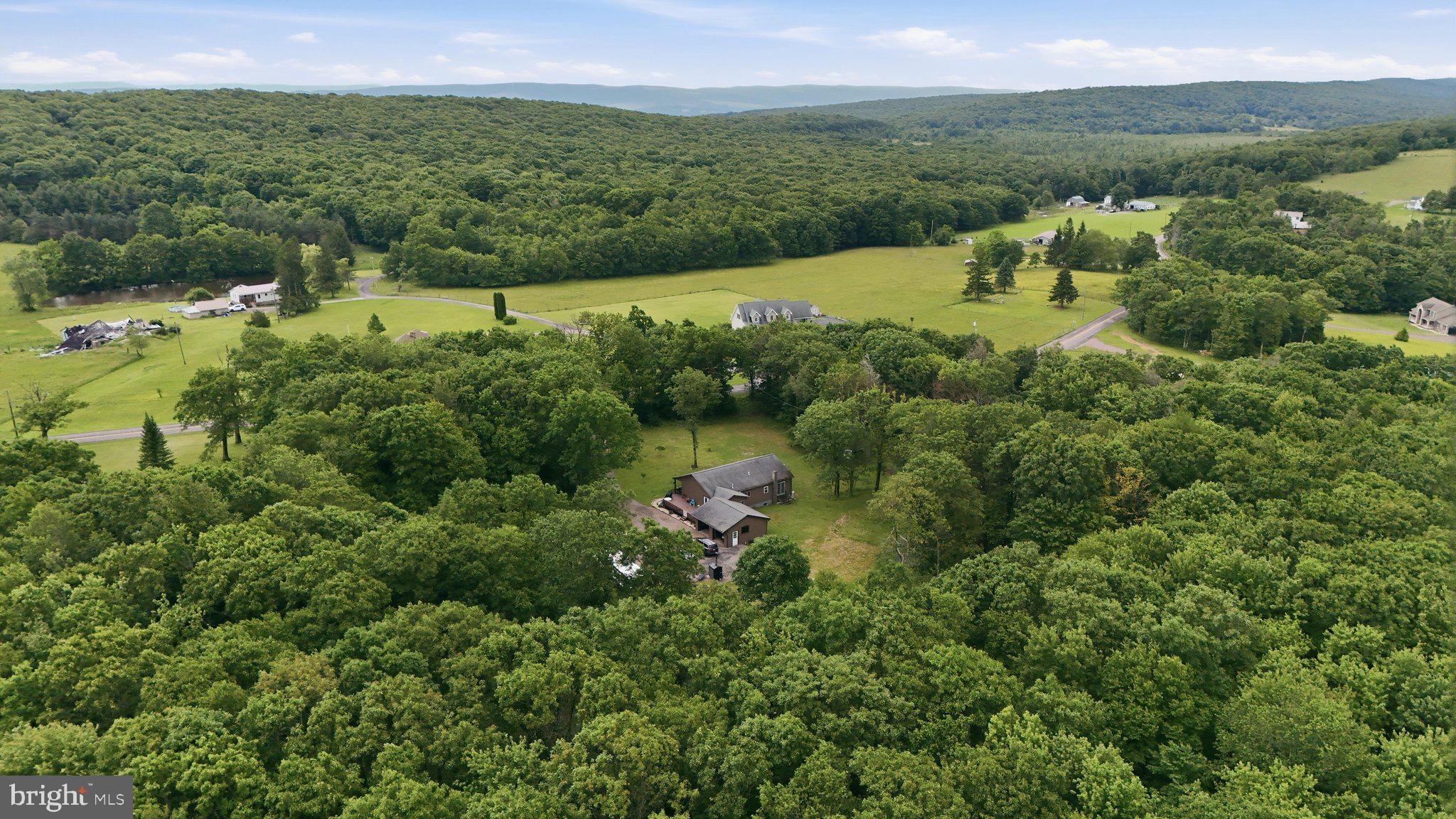 Escape to the peace and privacy of country living with this well-maintained 2 bedroom, 2.5 bathroom home situated on 5.5 unrestricted acres! Tucked away in a secluded setting, this property offers the freedom and space you've been looking for while still providing the comforts of home.
Inside, you'll find a spacious floor plan featuring a large primary bedroom, a dedicated dining room, and the convenience of main-level laundry. The finished basement offers an expansive rec room/family room, perfect for entertaining, relaxing, or game room. Need additional bedrooms? The basement living area could easily be converted back into bedrooms to accommodate your needs.
Outside, enjoy the privacy of your acreage with plenty of room for gardening, recreation, animals, or simply taking in the surrounding nature. An attached garage provides additional storage and convenience year-round.
If you've been searching for unrestricted property with room to grow, flexibility, and a peaceful setting, this one is a must-see!