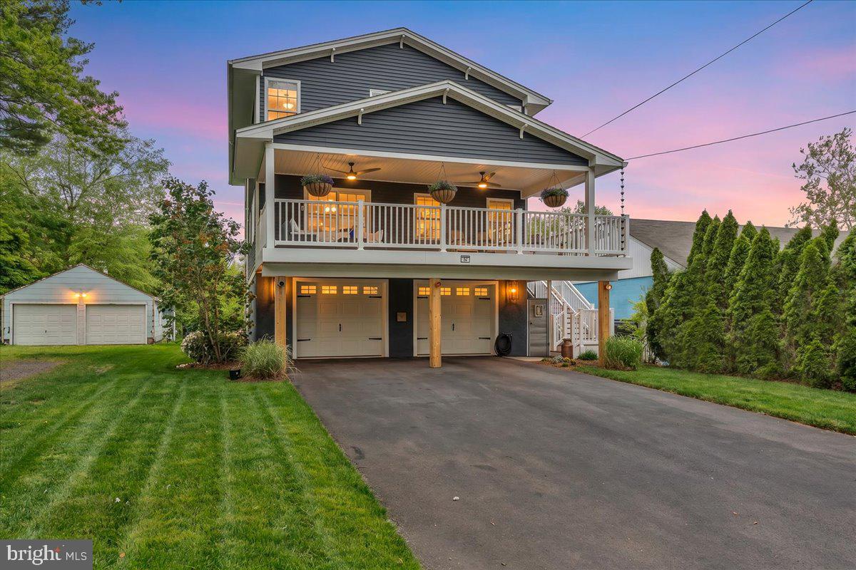 Nestled in the heart of the highly sought-after Flats neighborhood in Yardley Borough, this elevated and beautifully renovated home offers a rare blend of scenic Delaware River views, timeless character, and modern comfort. Meticulously designed, this sun-filled five-bedroom, three-bathroom residence creates a warm and inviting atmosphere from the moment you arrive. If you enjoy a home possessing wonderful curb appeal, decorating for the holidays, and widely recognized throughout the area, this is the one for you!
Inside, the home balances relaxed elegance with everyday functionality, offering spacious living areas designed for both quiet moments and effortless entertaining. The expansive primary suite serves as a true retreat, complete with a cozy fireplace and en-suite bathroom featuring custom stone and spa-like finishes. Refinished hardwood floors, coffered ceilings, updated bathrooms, quartz kitchen countertops, and stainless steel appliances add both style and sophistication throughout the home.

The river lifestyle this property offers truly sets it apart. Start your mornings with coffee on the deck overlooking the river, or enjoy hosting family and friends during beloved Yardley traditions like Harvest Day, held just outside your front door. Located less than a five-minute walk from Main Street, you’ll enjoy easy access to Yardley Borough’s dining, boutique shopping, coffee shops, and the scenic Delaware Canal for evening strolls or bike rides. Practicality meets charm with features that are increasingly difficult to find in the Borough, including an oversized garage ideal for collectors, hobbyists, or business owners. The rear yard also features a charming greenhouse and bluestone patio creating the perfect setting for gardening enthusiasts and evenings outdoors. For commuters, convenience is effortless with swift access to I-95, I-295, New Jersey Turnpike, and both Pennsylvania and New Jersey regional rail lines. 

Homes of this caliber and character in Yardley Borough rarely become available. This is a unique opportunity to own a move-in ready home in one of Bucks County’s most cherished river towns. Seller's note: This property was newly constructed and elevated in 2008.