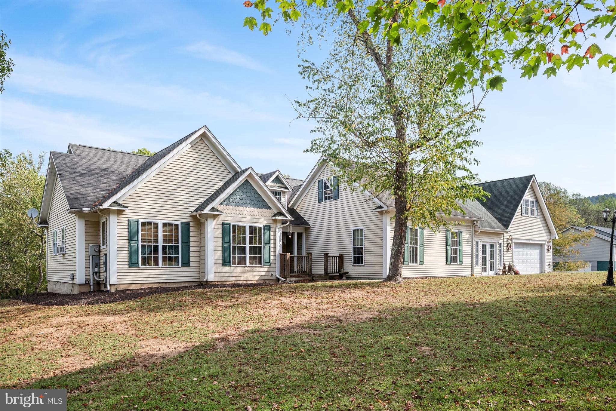 This home is waiting for its new owners to enjoy the Back Creek access for your summer fun.  This beautiful home that was just had the main level freshly painted.  This spacious ranch-style home on 5.86 acres in the desirable Birch Creek subdivision. With over 5,000 square feet of living space, this property is designed for both comfort and versatility.

The main level offers three bedrooms—including a primary suite—along with a cozy living room and a large great room for gatherings.   Off of the  kitchen, stairs lead to a versatile upper-level space above the garage, featuring a possible bedroom, half bath, and rec room—ideal for guests, hobbies, or entertaining. A covered front porch and attached 2-car garage add to the home’s convenience and charm.

Outdoors, this property truly shines. With nearly 6 acres of land, there’s plenty of room to roam, garden, or enjoy peaceful country views. The property also offers access to Back Creek, complete with a private boat dock and pavilion—perfect for fishing, kayaking, or simply relaxing by the water.

Offering the best of country living with modern conveniences, this exceptional property is a rare find—schedule your showing today!