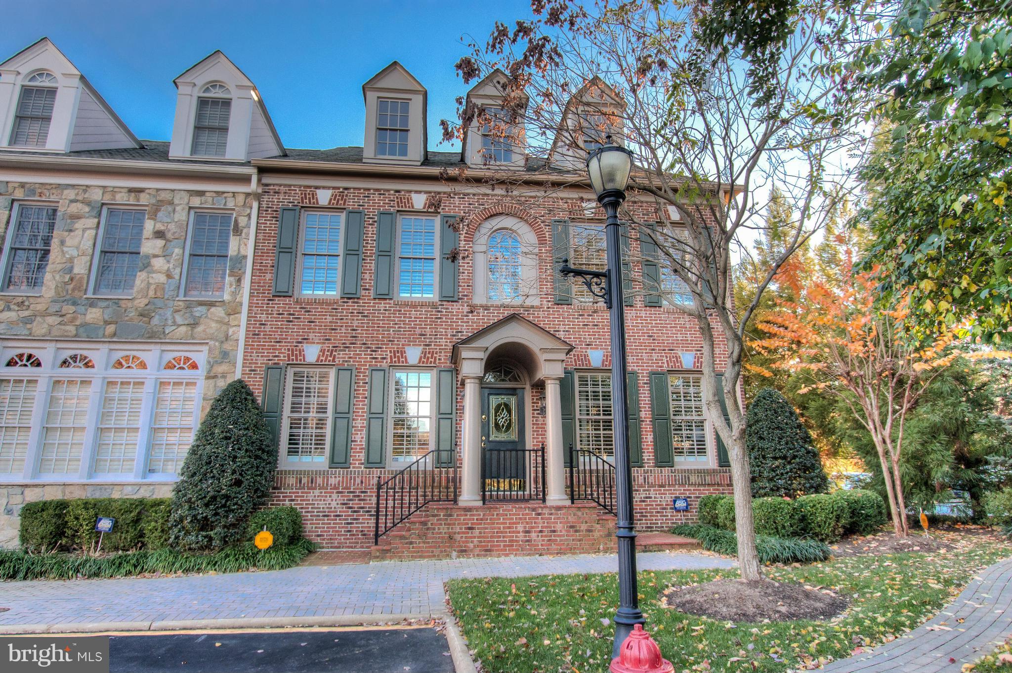 Offering easy luxury living in McLean's premiere gated community, this Evans Farm end-unit townhouse showcases quality craftsmanship on a grand scale. This Albemarle model, one of Evans Farm's largest townhouse floorplans, features an elevator, 2-car garage accessed via the main level, chef's kitchen with Subzero & Viking appliances, California Closets, grand owner's suite, brick courtyard, & more