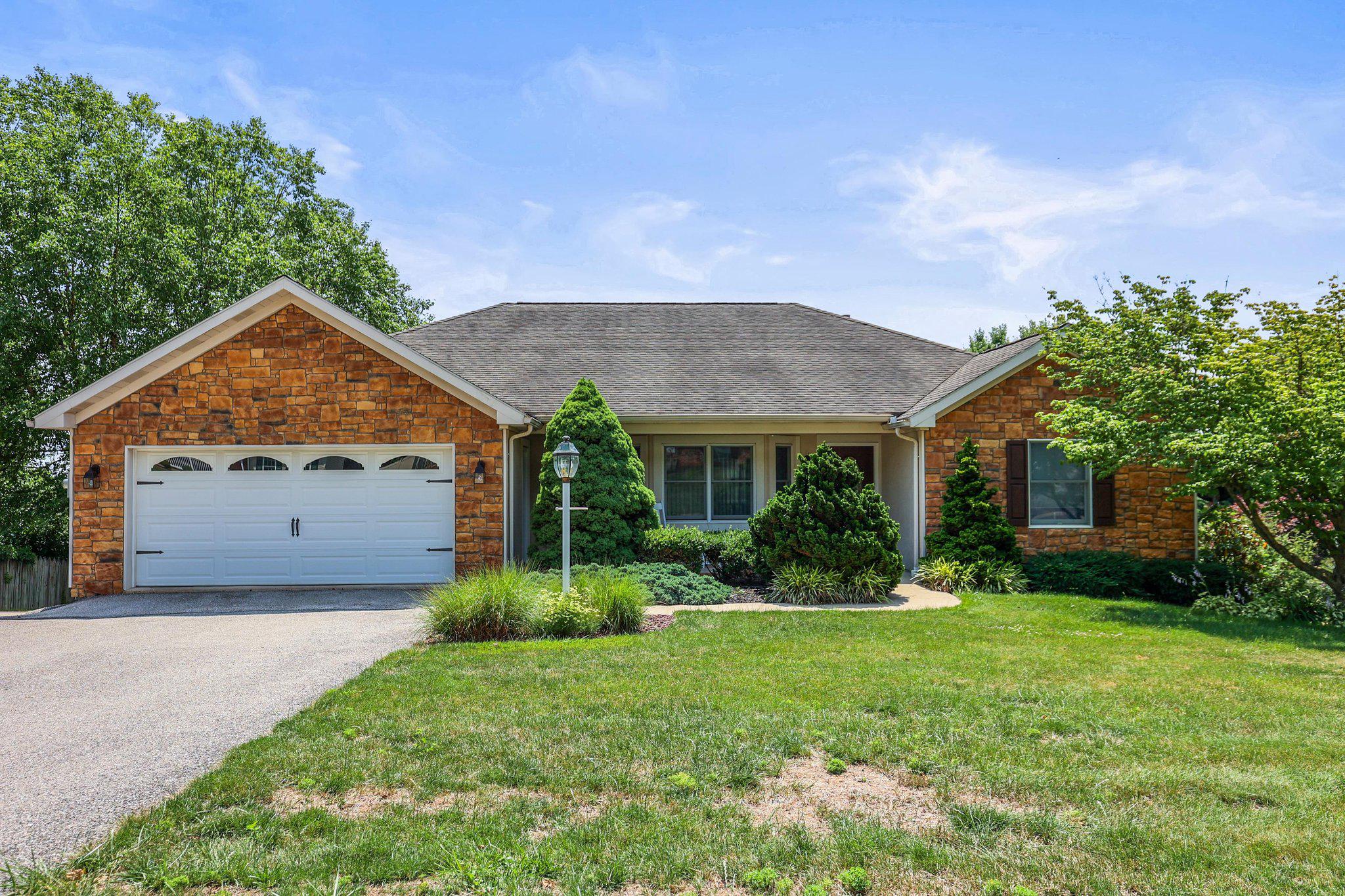 Welcome to 151 Overview Circle E. This well maintained home offers over 2,000 square feet above grade of comfortable living space. There are 3 bedrooms, and 2 full baths on the main level. The floor plan is designed for everyday living. You will have the ease of a laundry room on the main floor.  A fully equipped kitchen with breakfast bar with room for a table. Enjoy your bright and welcoming living room with a cozy gas fireplace. Entertain or just sit out on your large deck with a beautiful view. When you go down to the lower level you will find a huge open family room with another cozy fireplace, a small kitchenette, and  3rd full bath. There is a utility room that also has a hot tub and lots of space for storage. Step out onto the covered patio and enjoy the nicely landscaped yard. Car enthusiasts, hobbyists, and anyone needing exceptional storage will appreciate the attached garages with capacity for up to six plus vehicles. There is a two car garage on the main level, and a four plus car garage on the lower level that you enter from the rear of the home. Parking won’t be a problem here with a very large paved driveway. This home is one you won’t want to miss!