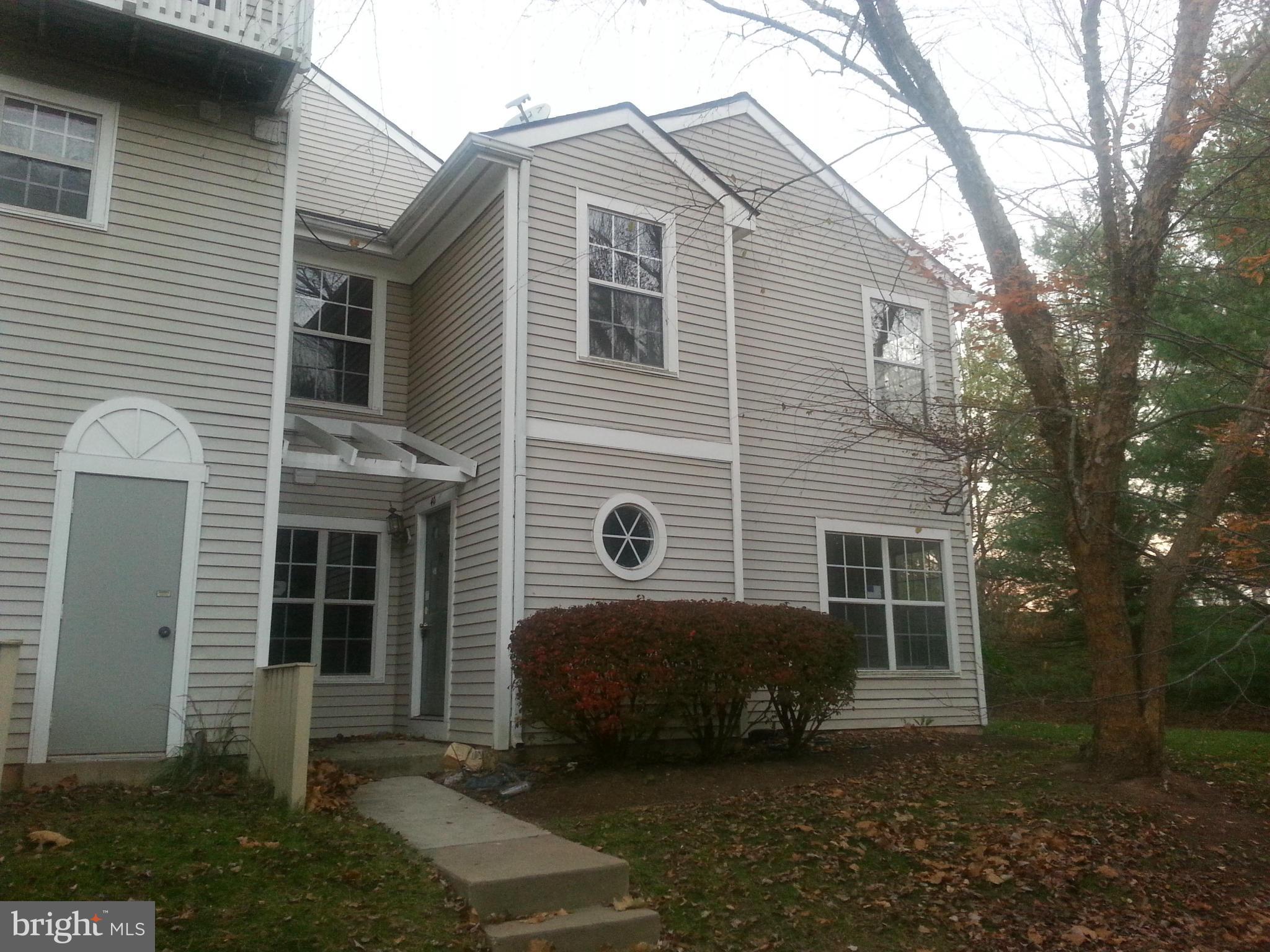 Newly renovated, Freshly Painted, New Wood Floors in Foyer and Living Room, Lots of Space.  Circular Floor Plan. LR & DR with Fireplace that opens to both with new Glass Doors. Private Setting, backs to Green Space. Close to Shopping, Commuter Routes