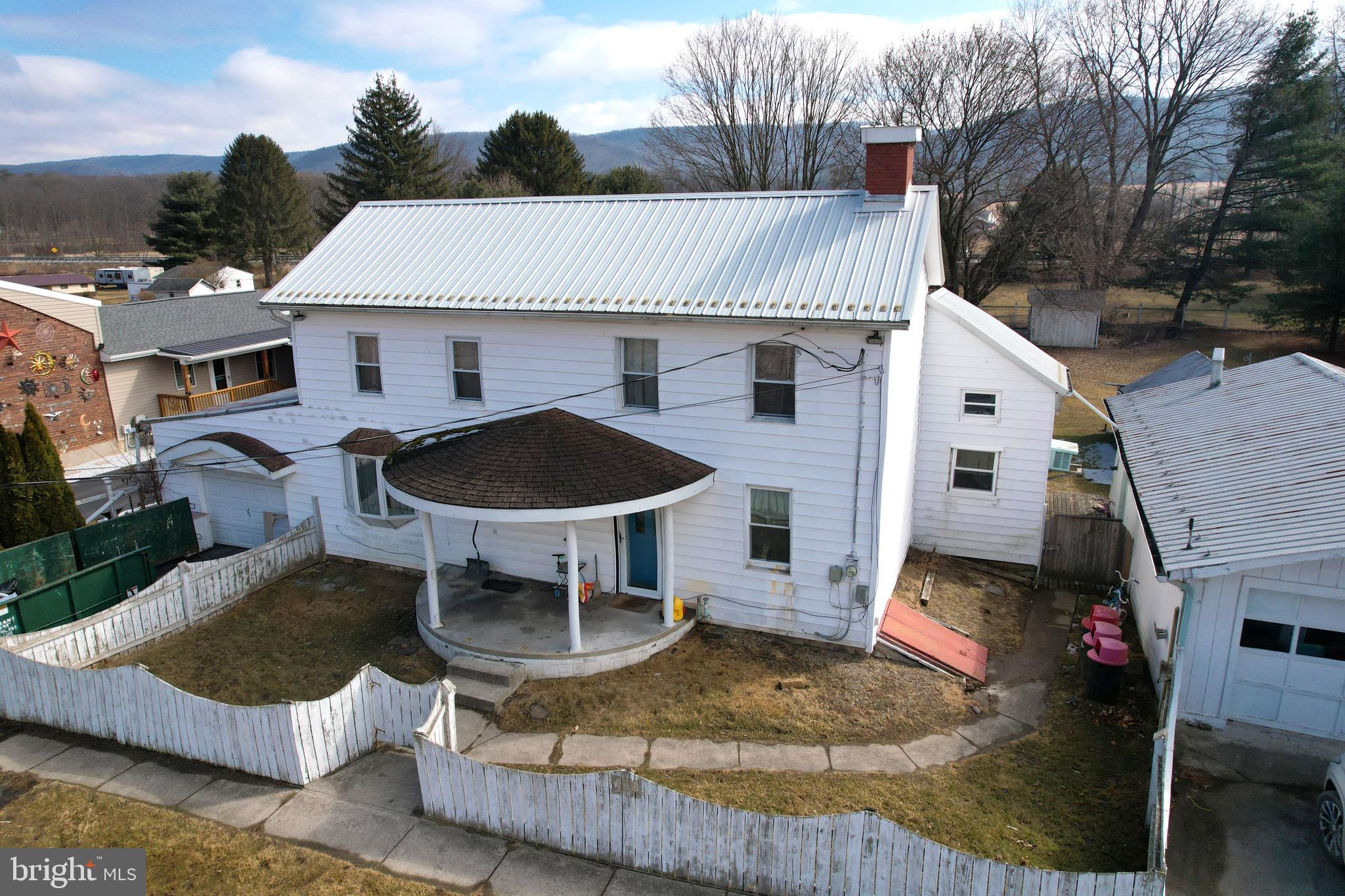 The main level of this classic two story home in the Bellefonte Area School District features a living room with a fireplace, kitchen, full bathroom, first floor bedroom, family room, and a flexible space that could be an office or extra storage for the kitchen. Upstairs are two sizeable bedrooms, another full bathroom, and a walk up attic for plenty of extra storage space. Outside you will find on this 0.61 double lot a fully fenced in front and back yard, with a 2 car detached a garage and a 1 car attached garage.This home is priced to sell “as-is” knowing that someone with the right vision and some elbow grease can make it their own! Conveniently located 20 miles outside of State College and Penn State University halfway between Bellefonte and Lock Haven.