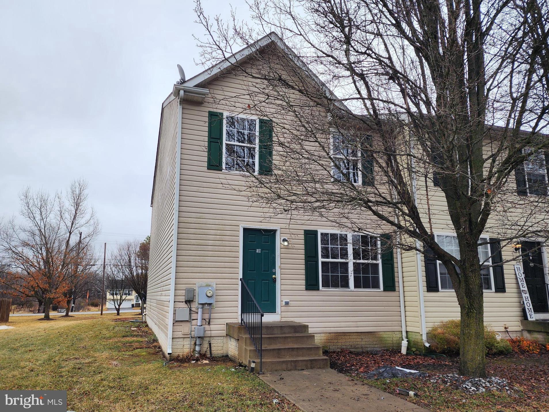 End-unit opportunity alert. This 3 bedroom, 3.5 bath townhome comes with a fully finished basement and its own staired outside entrance, giving you flexible space for guests, hobbies, or your next big idea. Located just minutes from the interstate, shopping, and very close to the Virginia state line, convenience is built right in.  Yes, it could use a little cosmetic love. Think drywall touch-ups and new carpet. The good news? You get to pick the paint colors and flooring instead of living with someone else’s “bold design choices.” Solid overall condition and priced with room to personalize. Bring your vision and make it your own.
