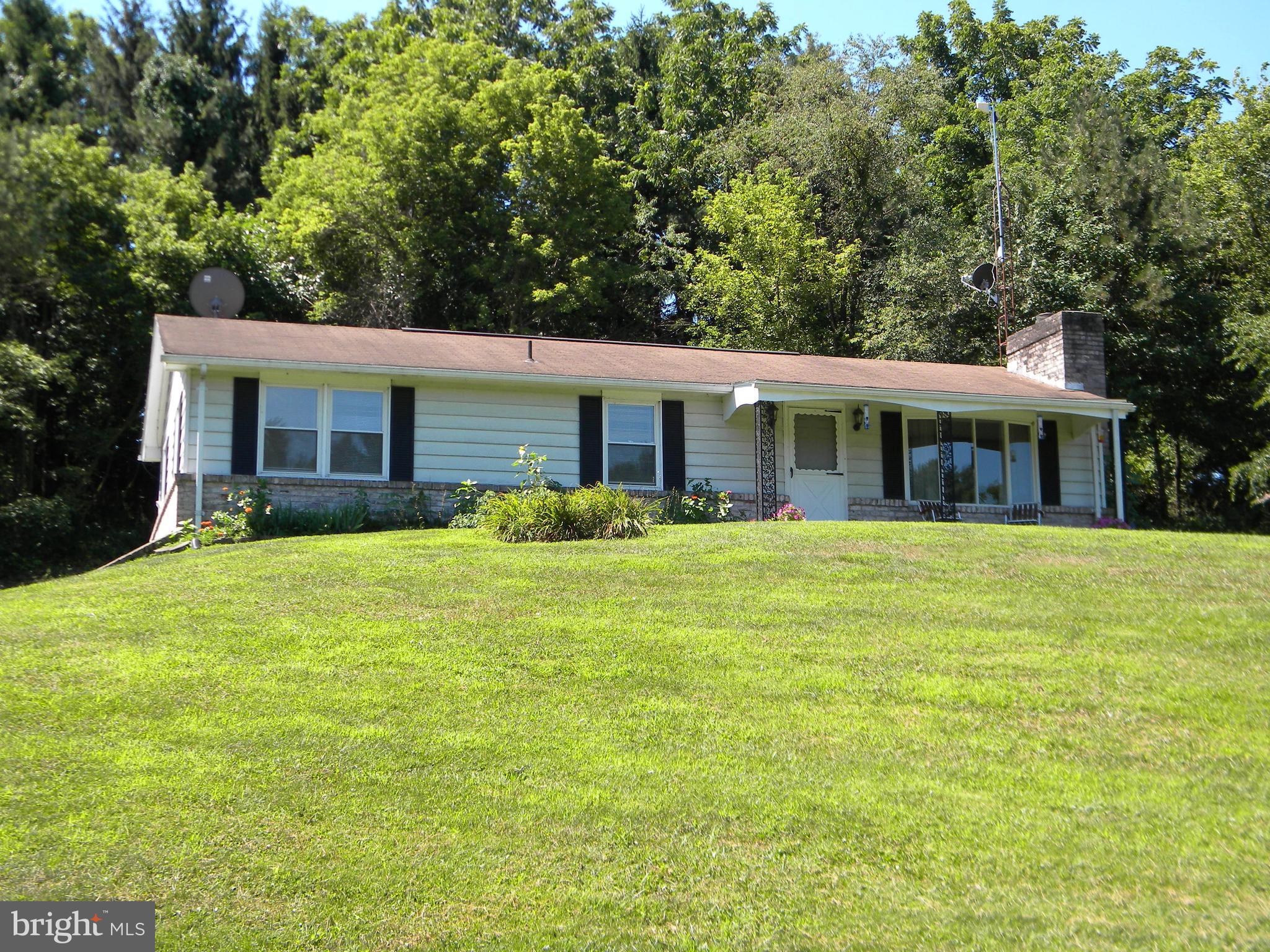 private and secluded rancher w/2 car garage on 5+ acres.   wooded and cleared for your enjoyment.  3 bedrooms on main level, Spacious LR w/fireplace and DR just off Kitchen ...  Plain and Simple Enjoyment