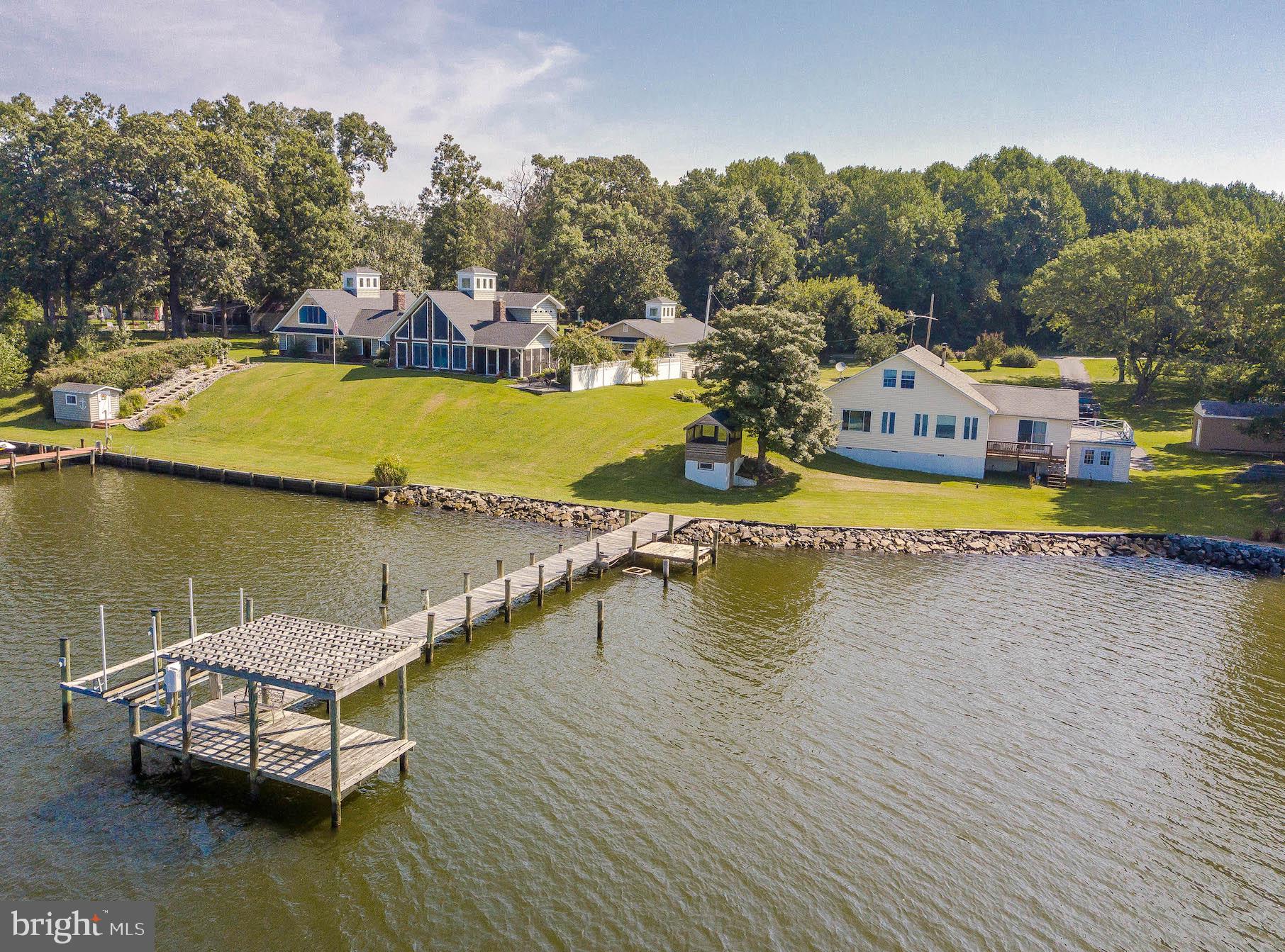 Delightful "cottage-y" Cape on desirable Cuckold Creek--perfect weekend getaway or comfortable year-round home! Enjoy tranquil water views and fun water activities alike in Hollywood (easy drive from DC, NoVa or northern MD). Largely renovated in the 90's, there's a big kitchen w/Corian counters, recessed lights; good-sized living/dining area with a view; primary BR & bath off to the right w/relaxing water view; two more bedrooms on the left, with another full bath for guests. Upstairs, you'll find a large loft, extending front to back, with storage under the eaves. Would make a great game room, office, kid space, extra sleeping space, too! Pier with lift, septic replaced in 90's with reno, oil heat & CAC plus ht pump for loft, one-car garage & shed. LOCATION LOCATION LOCATION--this view is hard to beat!
