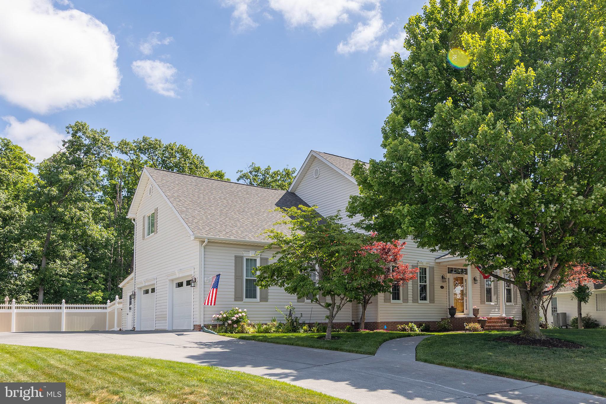 4 Bed/3.5 Bath Colonial backing to a common area with mature trees for added privacy. Oversized attached 2-car garage features a utility sink, workbench, and built-in shelving. Hardwood flooring on the main level. The upper-level primary suite offers two walk-in closets and an updated bathroom with a new shower. Convenient laundry hookups are located in the mudroom, with an additional laundry area and utility sink in the basement. Enjoy the fenced backyard complete with a spacious patio, attached storage shed, fire pit, and beautifully landscaped yard. Mature trees provide shade to the front yard, while butterfly bushes and a native butterfly and bee garden create an inviting outdoor retreat. Additional features include two bay windows, a covered front porch, and an irrigation system. New roof & gutters 2019,  new windows & patio doors 2020, new HVAC (Lennox) 2024,  fencing 2025, new gas water heater 2025, primary bedroom & bathroom renovation 2021, and much more! Extra storage in the attic. Be sure to view the attached 3D virtual tour!