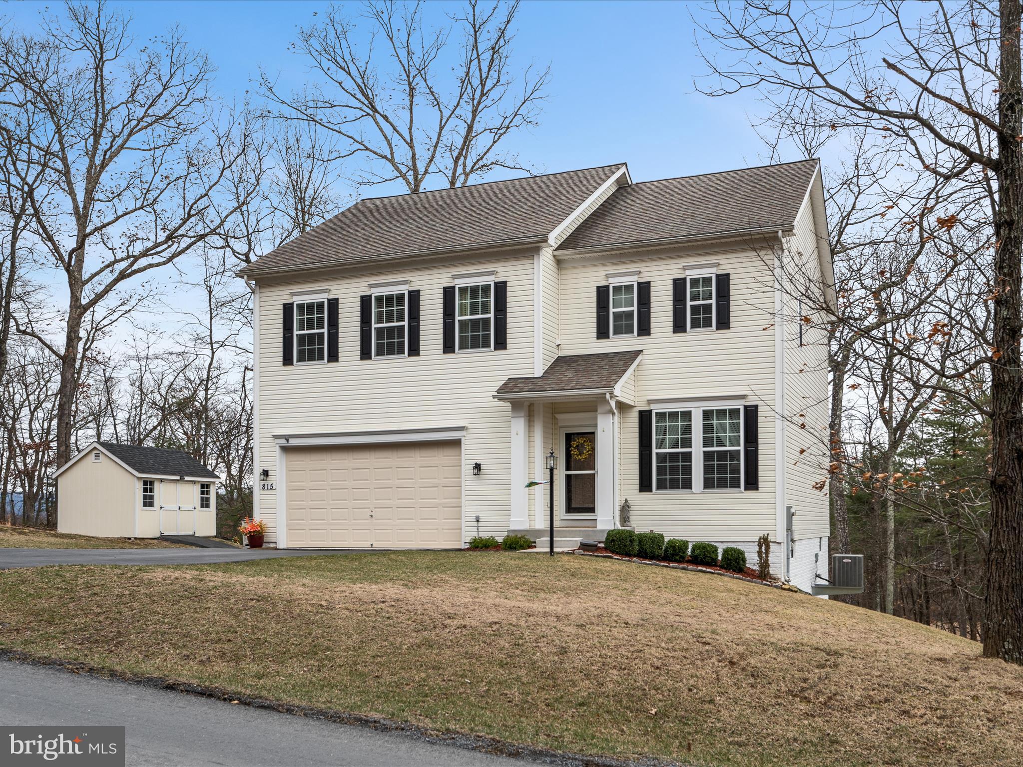 Welcome to your dream LAKE home! This stunning 3,200 finished sq ft colonial showcases impeccable design and is truly move-in ready! Step into a chef’s paradise with a gourmet kitchen featuring beautiful granite countertops, 42-inch cabinetry, and stainless-steel appliances, complete with a center island and a large pantry for all your storage needs. Entertain in style in the expansive living room, which boasts a cozy fireplace and flows seamlessly from the kitchen. Gorgeous hardwood flooring on the main level and 9ft ceilings throughout. The upper level offers an open den area that connects three generously sized bedrooms, including a luxurious primary suite with an en-suite bathroom and a walk-in closet. For added convenience, the laundry room is located on the same floor. The fully finished basement adds even more living space, featuring a large family room, a third full bathroom, and a sizable fourth bedroom that is perfect for in-law quarters or guests.  Step outside to discover a wonderful screened-in covered deck that overlooks a serene wooded common area, providing ample privacy for your enjoyment. Unwind in the hot tub while surrounded by nature and wildlife. Located just a short walk from the main beach and community amenities, this home is perfectly situated in a gated lake community. Don't miss the opportunity to make this exquisite property your own! Amenities include tennis/volleyball/pickleball/basketball courts, fishing pier and picnic areas, clubhouse fitness room, 3 sandy beaches, walking and hiking trails, dog parks … all within 20 minutes of Winchester!