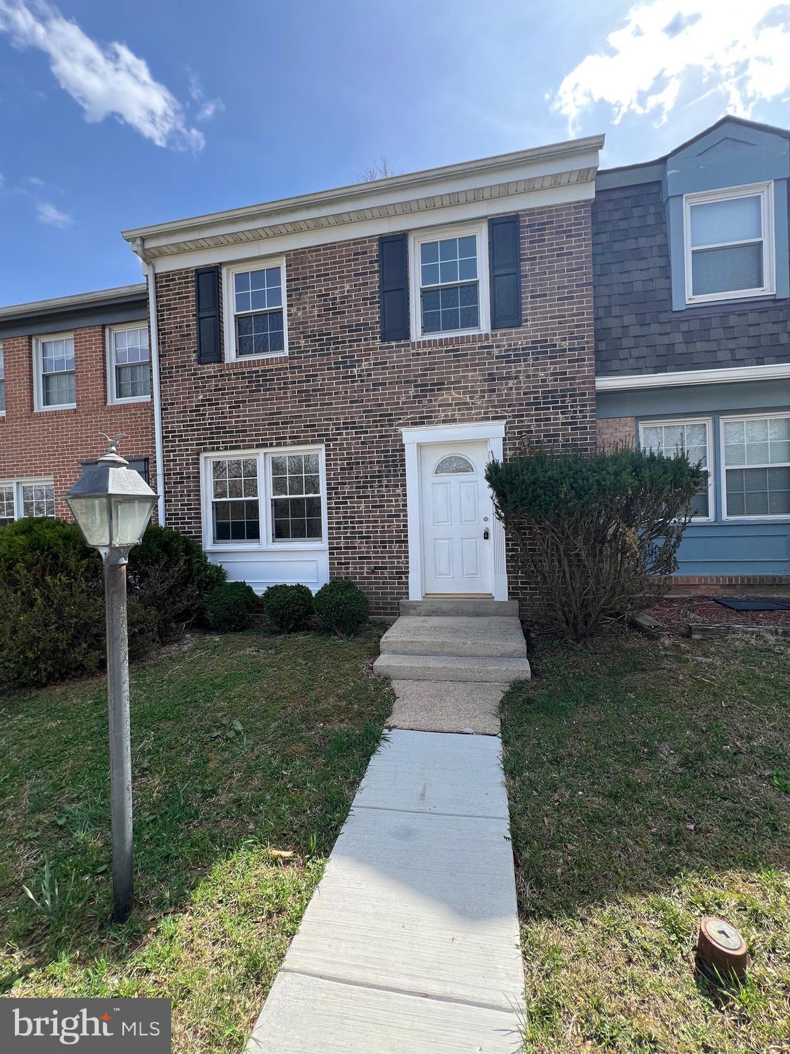 Freshly painted townhome with fenced back patio, renovated bathrooms, and move in ready.