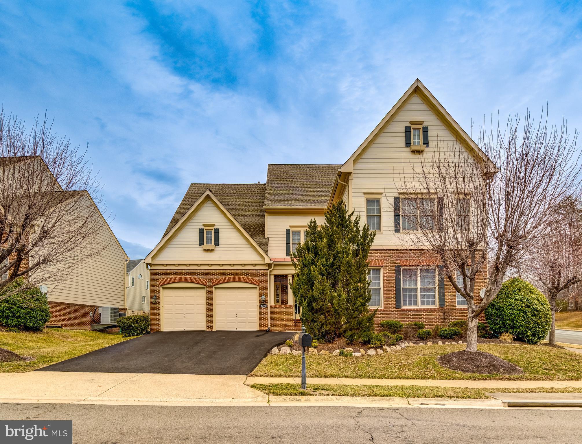BACK ON THE MARKET! Open House 3/23 from 1 pm -4 pm.  VA ASSUMABLE LOAN at 2.6% INTEREST RATE. 8,300+ SQFT of living space across four finished levels, located on a coveted corner lot in the highly sought-after River Falls community in Lake Ridge.  6 spacious bedrooms, 7 full bathrooms, and 2 half baths. Main level features 10 ft. soaring ceilings with 3-piece crown molding, spacious foyer, and the living spaces include a formal living room and dining room, private office and hardwood floors. The gourmet kitchen is a chef's delight, featuring stainless steel appliances, granite countertops, a large walk-in pantry, butler's pantry, and eat-in kitchen area with custom 2-inch louvered shutters. The floorplan seamlessly flows into the large family room with two-sided fireplace and spacious solarium with custom shutters. Step outside to the maintenance-free deck, featuring a beautiful gazebo and stamped concrete patio, perfect for morning coffee and evening entertaining. The upper level offers a grand primary suite with sitting area, two air conditioned walk-in closets, and a beautiful bathroom with dual vanities, 3-piece crown molding, Jacuzzi soaking tub, large shower with private water closet and custom louvered window shutters. Four additional bedrooms are also on this level—two with private ensuite bathrooms and two sharing a convenient Jack-and-Jill bath—along with a dedicated laundry room. The third level adds a large private suite, including a living area, bedroom, full bath, and walk-in closet—ideal for guests or extended family. The lower level is an entertainer's dream, featuring a full bar, recreation area, fitness room, second office, 8-seat theater room with JBL Atmos/surround sound system, half-bath and two full bathrooms. You will also find ample storage space and room for future washer/dryer hookup.  3-car garage, newly paved driveway, and abundant street parking. ROOF (2018), HVAC (2018) The River Falls community offers a wealth of amenities, including a pool, clubhouse, tot lots, tennis and basketball courts, and its location within the Old Hickory Golf Course community adds access to an 18-hole professional course and a clubhouse with a ballroom, bar, and restaurant. Enjoy a prime location near shops and restaurants, including a farmer’s market, County Center shopping center with Harris Teeter, Stonebridge Shopping Center with Wegmans, Potomac Mills Mall, and more. Nearby parks, trails, and recreation facilities, such as Chinn Aquatics & Fitness Center, Prince William Ice, and Waterworks Water Park, offer endless options for leisure. The Occoquan and Potomac Rivers are perfect for fishing, boating, and water activities. Commuting is effortless with easy access to Prince William Parkway, I-95, VRE, and commuter lots. Situated in the sought after Westridge Elementary, Benton Middle, and Colgan High School districts, this home truly has it all. Don’t miss the chance to make this yours—welcome home!