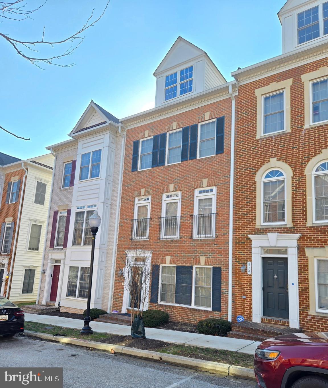 THIS IS THE ONE YOU'VE BEEN WAITING FOR! Welcome to this beautifully maintained home in desirable Camden Crossing, perfectly situated on a quiet, tree-lined street in the heart of the city. Offering the ideal blend of charm, space, and convenience, this home checks every box for comfortable city living. The entry level features a private bedroom with a full ensuite bath — ideal for guests, roommates, or a home office. On the main level, a unique sunroom bump-out fills the space with natural light and adds both character and extra square footage for relaxing or entertaining. You'll love sitting out on the deck enjoying your morning coffee too! Upstairs, you’ll find three additional bedrooms, making this property an excellent opportunity for both owner-occupants and investors. Custom closets enhance the spacious primary bedroom, while thoughtful upgrades — including a new stackable washer and dryer and a new furnace — provide peace of mind. Freshly painted from top to bottom and featuring brand-new carpet throughout, this home is truly move-in ready. Located just minutes from University of Maryland Medical Center and with easy access to I-95, commuting is a breeze. A rear-entry garage plus a private driveway offers the convenience of parking for two vehicles — a rare find in the city! Don’t miss this exceptional opportunity to own in one of Baltimore’s most convenient locations. WELCOME HOME!!