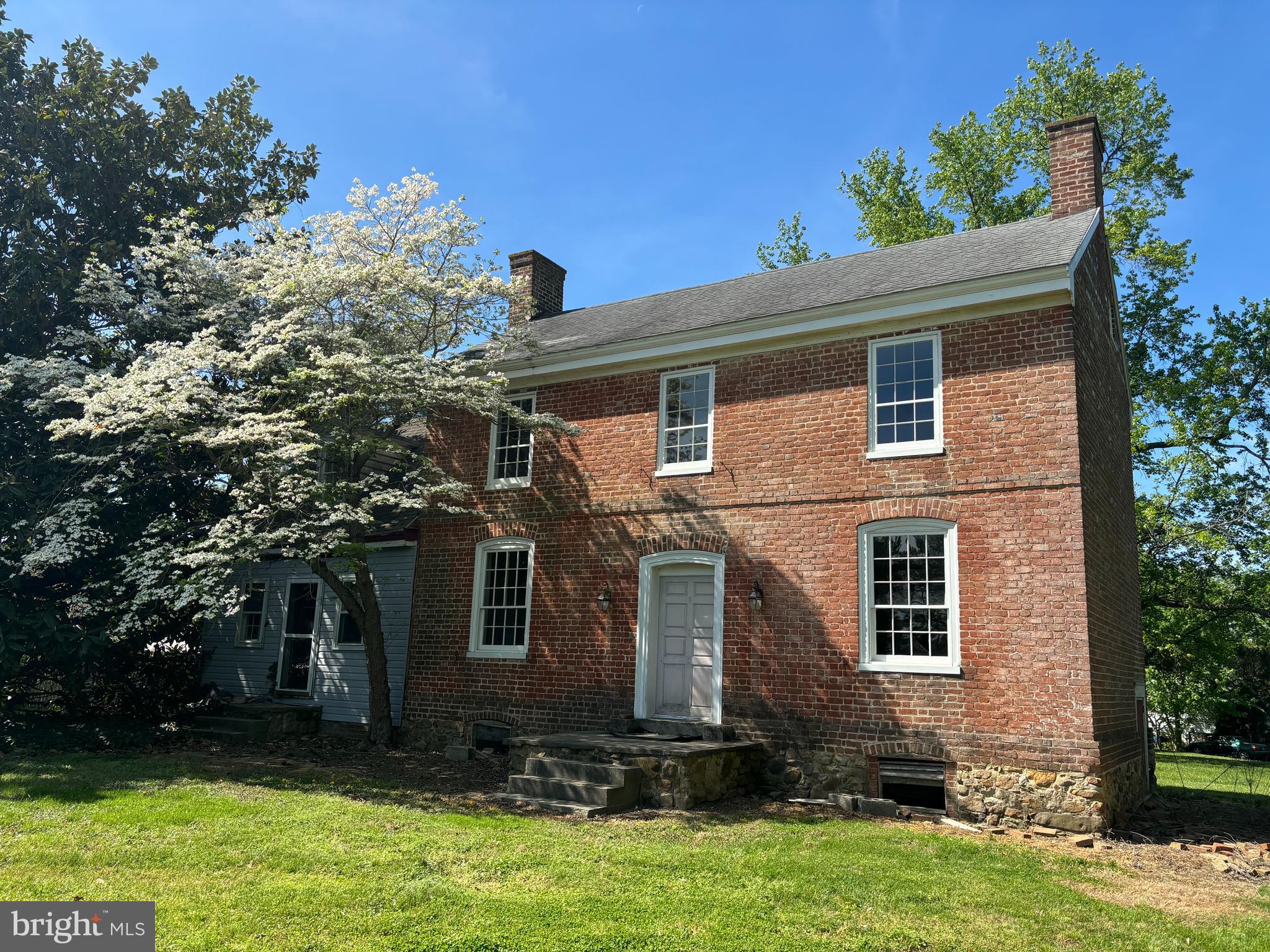 Important Georgian residence built in 1763 by Quaker Emanuel Jenkinson. House contains much original  raised paneling, built-in cupboard, paneled doors, wide-board flooring etc. The house sits on a 1660s land-grant called "Edmondson's Freshes".  Today the neighborhood is known as "Stoney Ridge"  Seller has the brass front door lock and other useful 18th C, hardware. No restriction against moving the house to a waterfront building site . . . Listing agent is owner. The house was largely re-wired in the 1980s. In 2009 the windows were rebuilt using mahogany, with salvaged wavy glass, The roof is of unknown age, but is over eighteen years.   Seller purchased the property in 2008 for $140,000 and can document over $150,000 on restoration: repointing the brick, restoring the windows, and cornices, installing French drains,, taking down trees,  The house was last occupied in 2007. It requires extensive further renovations and the task is not for the faint of heart.  The bathroom water pipes froze and burst in 2007 and have not been replaced, but that is not a difficult job. for a plumber. The property is not subject to the covenants and restrictions of Stoney Ridge A former owner removed the wide yellow poplar floorboards from one of the third story bedrooms to create a cathedral ceiling in the room below. Replacing the missing flooring would be an easy job.  Despite its condition, the house is worthy of restoration and is just waiting for an old house lover to complete the restoration.  Brick portion exterior measures 19' x 33 1/2'.