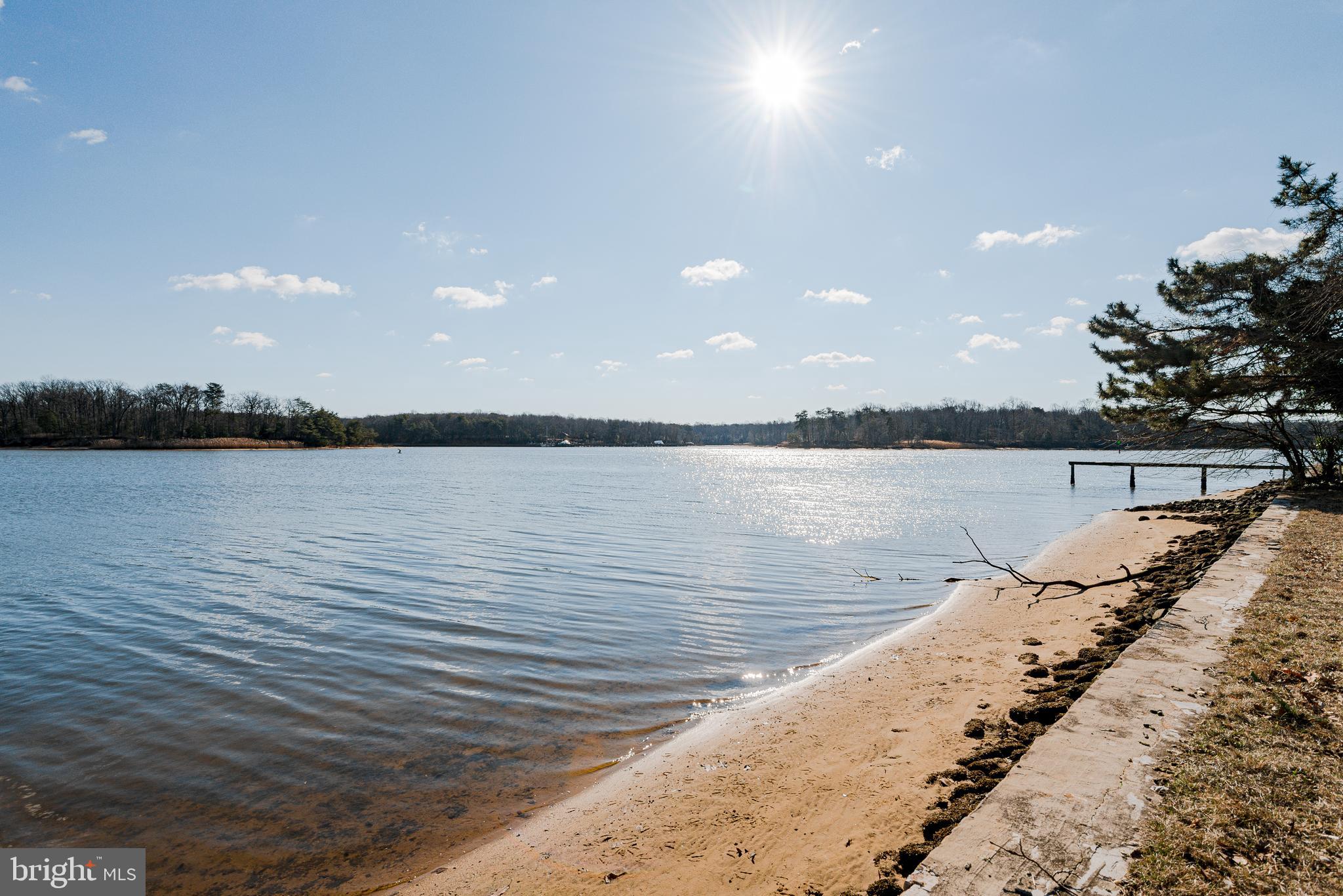 Agents and Guests  Please do not step on the pier it is not stable                               Newly Sub-divided community with 3 homes  and   Community water front .   Sandy Beach and Beautiful View !   Cute Waterfront Cottage!    This home needs some updating but  very livable .   Listing agent has full details.