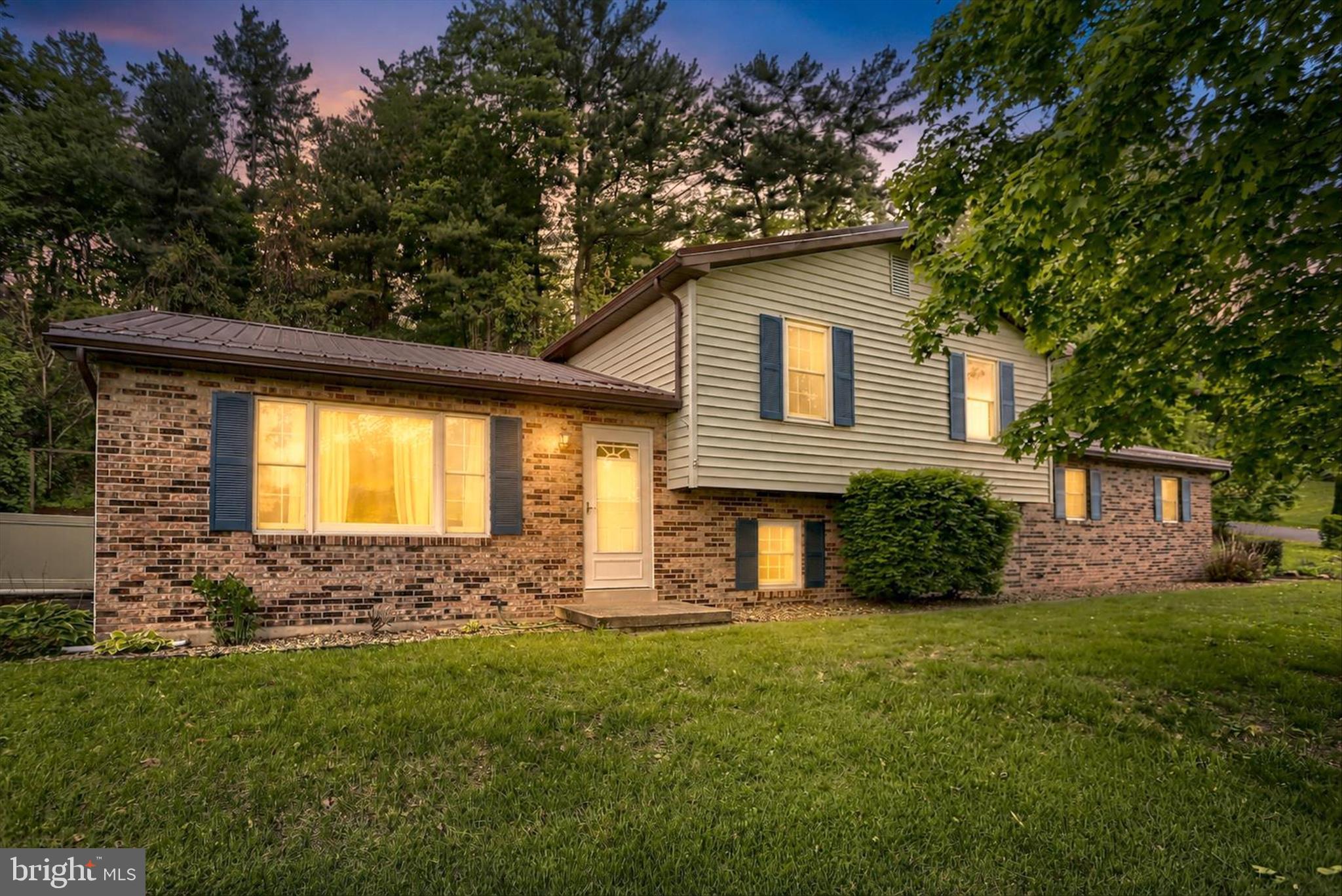 Welcome to 876 Campbell Drive in Newport—a beautifully maintained bi-level home that offers the perfect blend of comfort, convenience, and move-in-ready appeal. It was built in 1988 and features 3 bedrooms, 1.5 bathrooms, and 1,836 square feet of living space. This home is located in the Newport School District and sits on 1.4 acres just on the edge of town in a peaceful setting.

Step inside to find wood flooring throughout and a freshly painted interior that creates a warm and inviting atmosphere. The kitchen is a standout feature, showcasing custom hardwood cabinetry, stainless steel appliances, and plenty of space for cooking and gathering. All major appliances convey, making your move seamless from day one.

This home has been thoughtfully updated with key improvements, including a new metal roof in 2021, replacement windows, and a water heater installed in 2022—providing peace of mind for years to come.

Outside, the property truly shines. Enjoy beautifully maintained landscaping, a covered attached patio perfect for entertaining, and your own private backyard retreat complete with an in-ground pool with safety cover, and vinyl fence surround. A 2-car attached garage with additional storage adds both convenience and functionality.

Ideally located close to Route 322 and within walking distance to the Newport Fairgrounds, this home offers the best of both accessibility and charm.

From its updates to its outdoor amenities, this property checks all the boxes—don’t miss your opportunity to own a truly move-in-ready home in a fantastic location!
