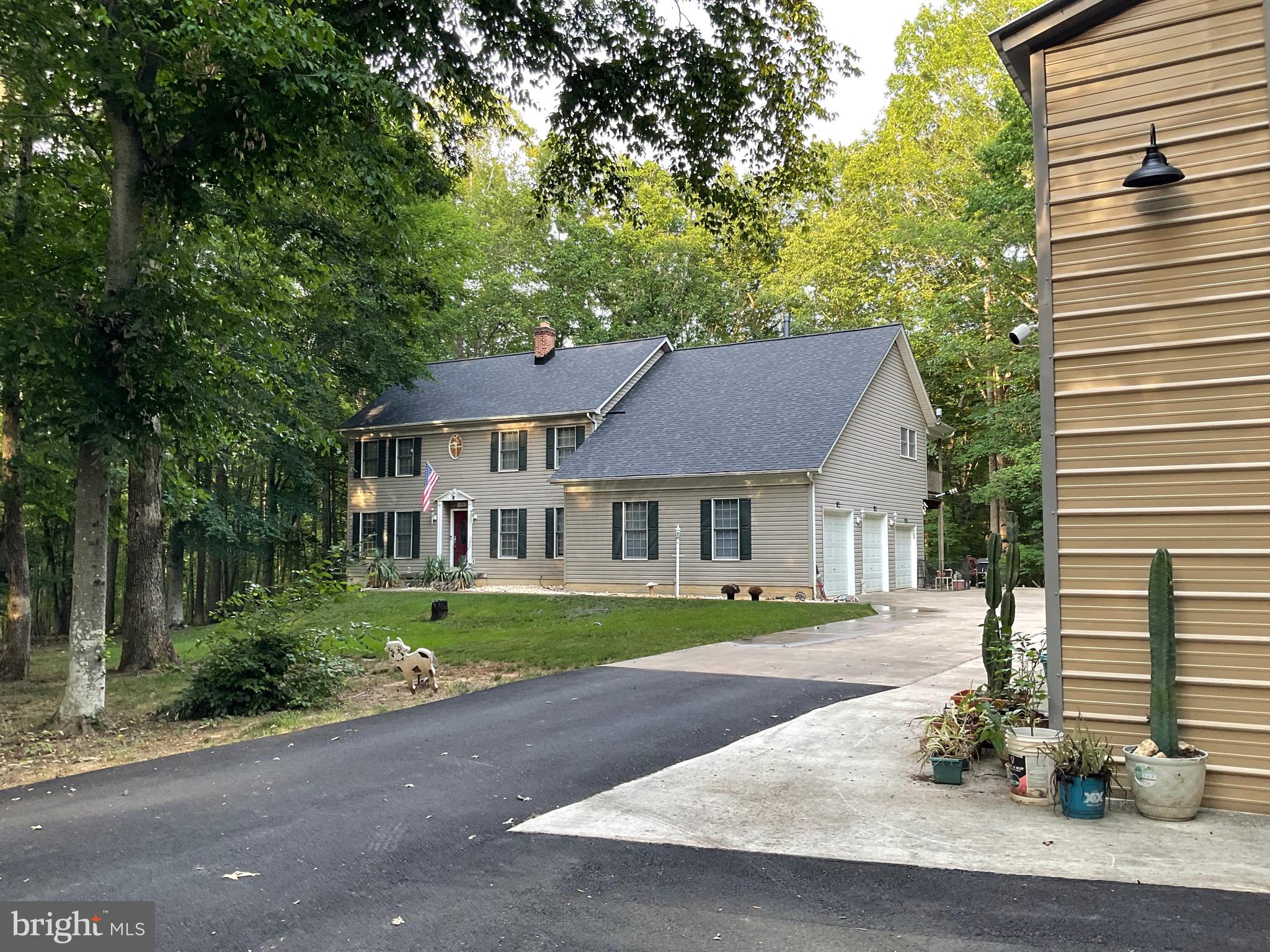 Beautiful Home on 10 private equestrian wooded acres.  So many upgrades:  2025 - New Roof/flashing & gutter guards - long driveway poured for heavy equipment w/enough space to turn a 40FT Rig.  Trees trimmed along the long driveway for a clean look  - New 50X22  separate garage on its own meter w/heat&AC - Receptacles for 30 & 50 AMP,  plenty of room in a 200AMP box  for improvements.  Extra large master bedroom with his and hers closets, fireplace, GENERAC Wholehome Generator - 4 yrs ago, serviced annually.  Main level totally gutted and remodelled 5 years ago with top rate hardwood flooring, to include staircase and landing on upper level.  Granite kitchen counters and mudroom.  Main house garage doors were serviced in 2026.  Back yard large enough clearance for your own private swimming pool.  County value of this property is valued at $1,125,000 - Seller motivated.