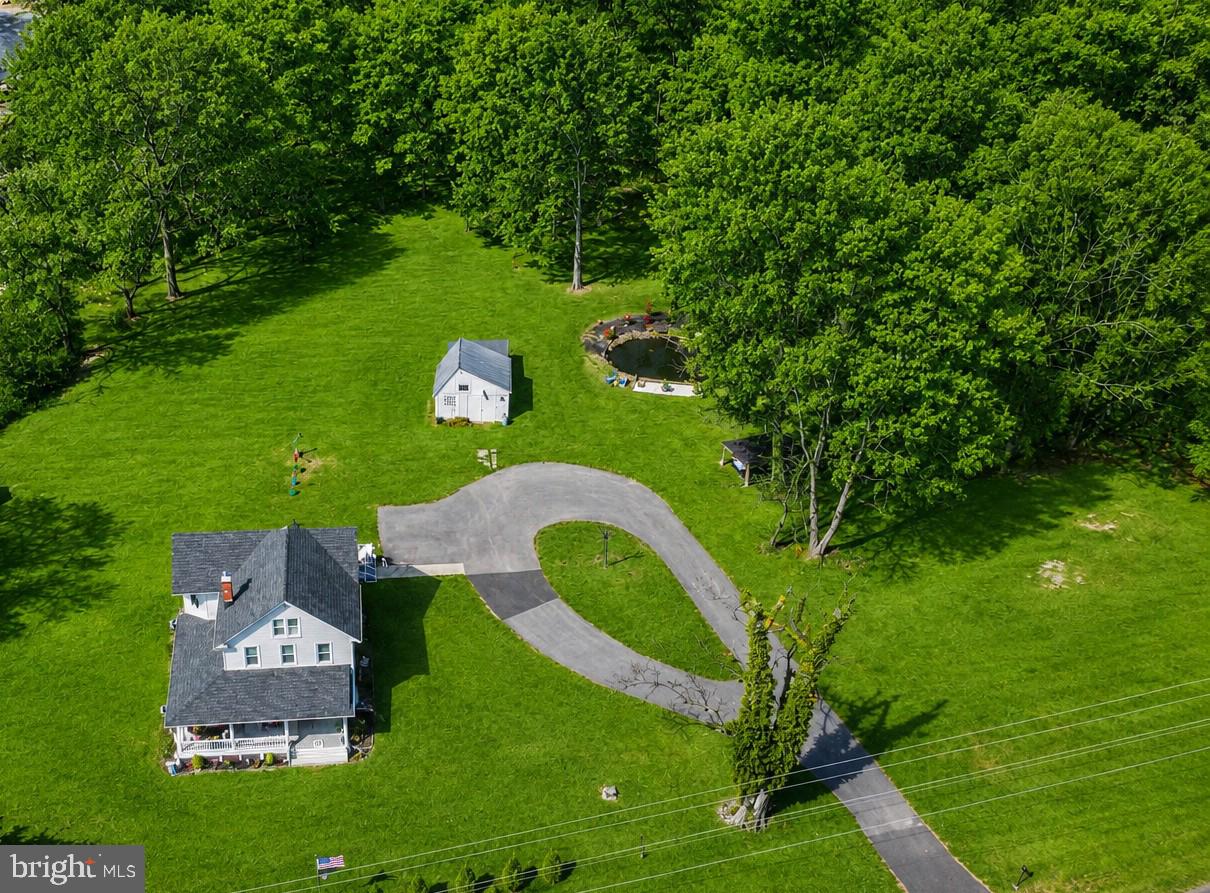 Bring the Horses, Cows, Chickens—or the Whole Barnyard! This Charming Country Farmhouse Sits on Nearly Five Agriculturally Zoned Acres

A breathtaking 1920s Victorian farmhouse estate where timeless elegance meets modern farmhouse luxury in the heart of Jarrettsville. Set on nearly 5 picturesque acres, this is a rare chance to own a fully updated historic home wrapped in serene countryside and unmatched charm.

Arrive via the graceful circular driveway and feel the sense of arrival build immediately — stunning curb appeal, a signature wraparound porch, and sweeping views that invite you to slow down and stay.

Inside, the home has been extensively renovated, preserving its architectural soul while delivering the modern farmhouse finishes today's buyers crave. Every room is light-filled, spacious, and designed for both everyday living and effortless entertaining.

 Interior Highlights
- New laminate flooring throughout (2023)
- New cabinets and countertops (2023)
- Updated main-level bathroom (2024)
- Fully renovated while preserving original Victorian character
- Bright, generous living spaces built for comfort and entertaining
- Possible 4th bedroom on the upper level (see photos)

 Resort-Style Outdoor Living
- Wraparound porch for timeless indoor-outdoor living
-Rear deck, perfect for relaxing  under the stars
- A tranquil pond setting a peaceful, picturesque tone
- Charming gazebo for gatherings or quiet reflection
- Nearly 5 acres of open, private land — endless possibilities

 Exceptional Property Features
- Beautifully updated 1800s barn — full of character, ready for hobbies, storage, or creative use
- Circular driveway with ample parking for guests, events, or multiple vehicles
- Brand-new BAT septic system (2023) for lasting peace of mind

Elegant. Private. Truly Unforgettable.
3808 Federal Hill Road — where historic beauty meets modern farmhouse living at its finest.