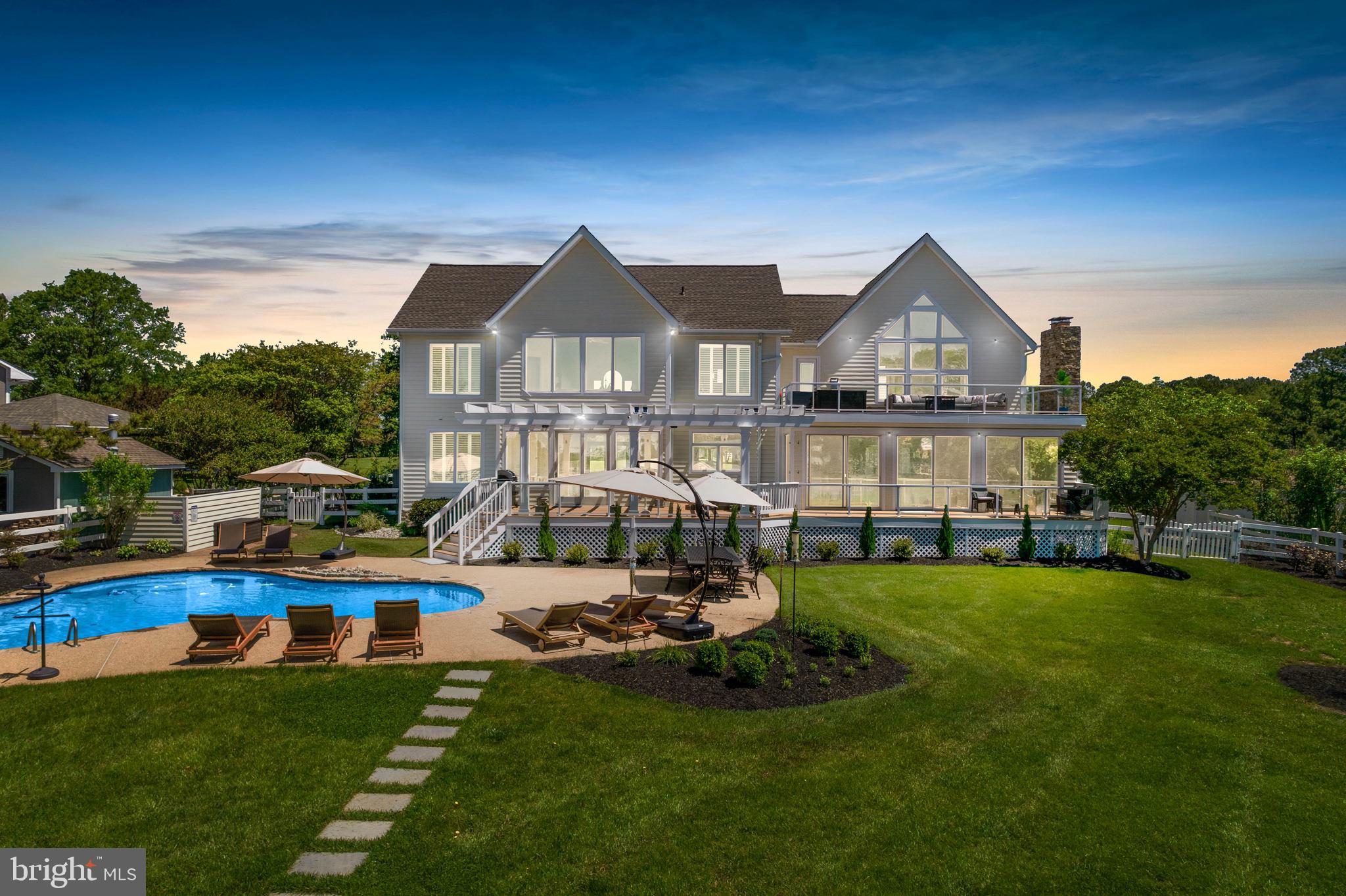 NEW IMPROVEMENTS! Welcome to 107 Terrapin Lane, a breathtaking waterfront, 6-bedroom, 3-bathroom home located in the heart of the desirable Cove Creek Club Community. Impeccable water views fill this home from every room. Situated on a 3.3 acre lot, this home boasts numerous gathering spaces both inside and out. It is truly an entertainers dream. Enjoy a private saltwater pool, hot tub, pier, multiple decks, patio, fire pit, exterior uplighting system, sprinkler system, amenities-rich community, and irresistible shoreline that creates a work, play, or rest environment.  The detached garage has been converted into a multi-use recreational room, consisting of a custom made concrete bar that includes a mini fridge, wine fridge, and cigar humidor. This space also has a pool and ping pong table, as well as a dart board, perfect for year round use with a newly installed wall heater. Walk outside and take delight in using your basketball court and private putting green.  All furnishings and amenities (excluding the golf cart and items in the locked closets) convey with the home. 
The Cove Creek Club Community is one of a kind, offering exquisite amenities such as the golf course, a private beach to its members, marina, tennis + pickleball courts, walking trails, club house, and more. The property is a quick and scenic drive to all of your local amenities such as grocery stores and restaurants, as well as the Bay Bridge. This home has been meticulously cared for and offers the perfect blend of comfort, convenience, and style.