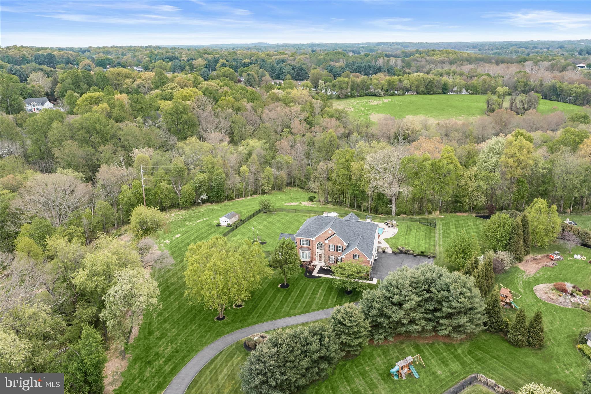 PRISTINE LUXURY ESTATE & ELEVATED RESORT-LIKE AMENITIES
Exceptional luxury estate offering nearly 8,000 finished square feet, ideally sited on a private cul-de-sac lot backing to a preserve parcel. This meticulously upgraded home showcases a seamless blend of elegance, comfort, and resort-style outdoor living.  Extensive recent upgrades provide peace of mind and modern appeal, including a new roof, HVAC, well system components, hot water heater, garage doors, major kitchen upgrades and bath renovations. The gourmet kitchen is beautifully updated with quartz countertops, a waterfall island, stainless steel appliances, gas cooktop, farmhouse sink, custom backsplash, and abundant cabinetry, flowing effortlessly into the breakfast area and sun-filled living spaces.

The main level features a grand two-story foyer with Brazilian mahogany floors and mosaic inlay, formal living and dining rooms with extensive trim work, a private study, and a stunning conservatory with walls of windows and heated floors. The spacious family room offers a gas fireplace with stone surround and opens to a bright sunroom with access to a low maintenance composite deck. There are two full-size sets of washers and dryers, along with a sink, counter space, and built-in cabinetry.

Upstairs, hardwood floors run throughout all bedrooms, including a luxurious primary suite with tray ceiling, sitting area, dual walk-in closets, and a fully renovated spa-like bath with heated floors, jetted air jacuzzi, and a spacious frameless glass shower. Secondary bedrooms are generously sized, featuring private ensuite or Jack and Jill baths. 

The fully finished walk-out lower level is designed for entertaining, complete with a recreation room, gas fireplace, custom wet bar with granite counters, game area, cigar/wine room with dedicated ventilation, sixth bedroom or fitness room with sauna, and a full bath with steam shower.

Outdoor living is truly exceptional, featuring a heated saltwater pool and spa, gas torches, pergola with stone fireplace, expansive composite deck with drainage system, gas firepit, porcelain paver patios, professional landscaping and mature trees.   Additional highlights include radiant heated tile floors, dual staircases, two gas fireplaces, upgraded lighting, a finished garage with built-ins, and extensive hardscape improvements.

A rare opportunity to own a thoughtfully upgraded, turnkey, executive home offering privacy, luxury, and exceptional indoor-outdoor living.