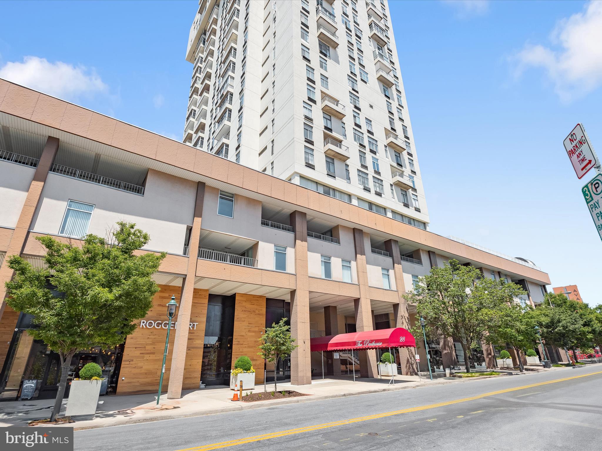Experience panoramic Towson views from this rarely available two-level penthouse featuring 3 bedrooms and 2.5 baths. Arrive in style through the welcoming reception area and take the elevator up to the 27th floor, where your private retreat awaits.
The main level showcases an airy open floor plan with fresh neutral tones and durable luxury vinyl plank flooring. Sunlight fills the spacious living room, which flows seamlessly into the dining area and out to a generous balcony, perfect for taking in the ever-changing colors of the seasons. The renovated eat-in kitchen is both stylish and functional, complete with new stainless steel appliances, granite countertops, abundant workspace, and the convenience of an in-unit washer and dryer.
Upstairs, plush new carpeting leads to the serene primary suite, highlighted by a wall of windows, a double closet, and a private en suite bath. Two additional bedrooms, each with access from its own private slider to the sky deck, and a refreshed full bath create a tranquil upper-level retreat.
With thoughtful updates throughout and access to community amenities including a clubhouse, rooftop pool, sky decks, elevator service, and optional garage parking, this penthouse offers the best of elevated living in the heart of Towson.

Note:  Some interior photos have been virtually staged.  Parking  space in garage available for $100 per month or $135 per month for a designated reserved space