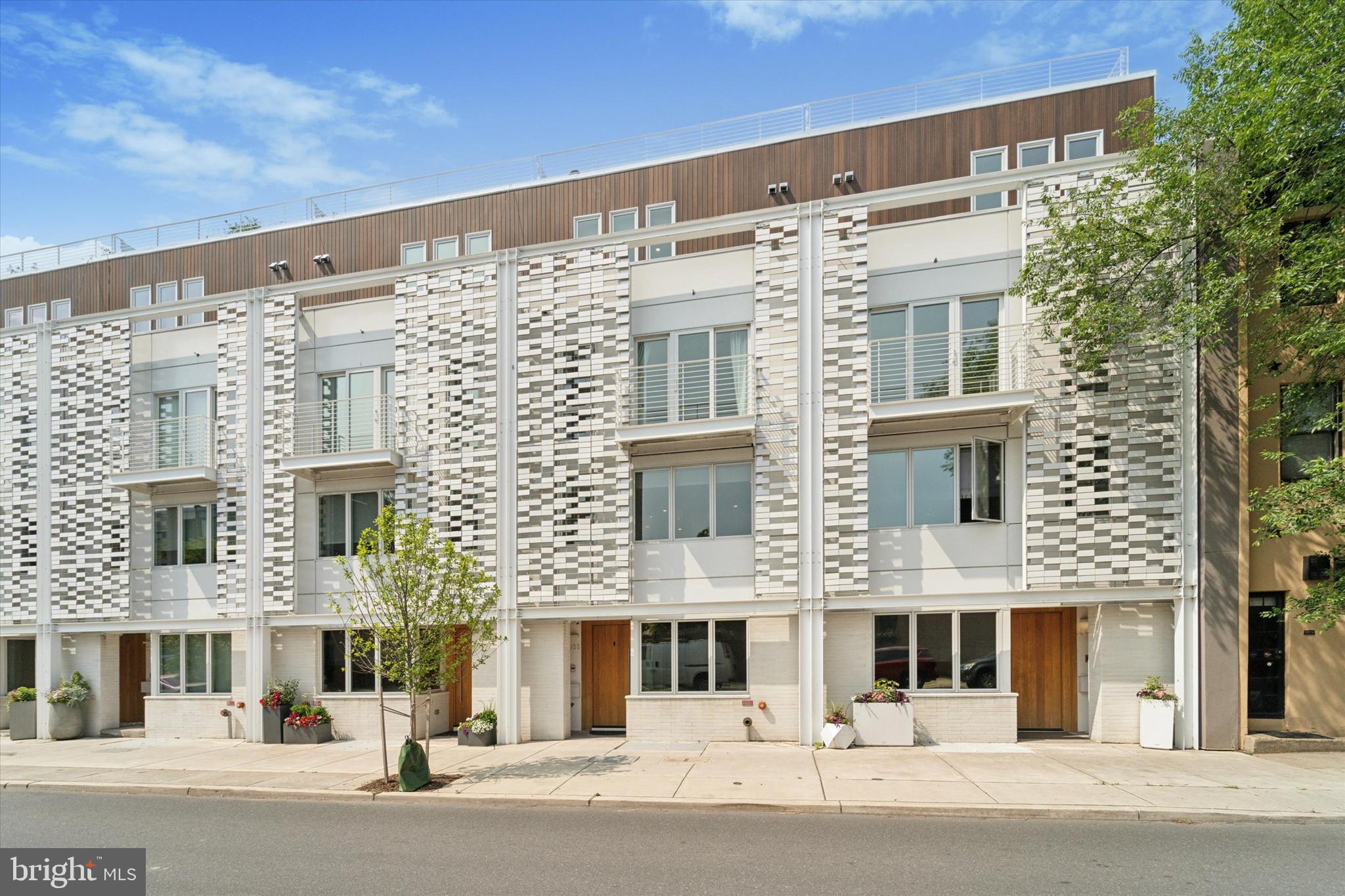 Luxury in Rittenhouse: Approx. 4,500 sq/ft, tax abatement until Feb of 2031, loads of parking, 2 outdoor decks PLUS a full-length rooftop (w/ 5-person spa, outdoor TV & incredible skyline views). Elevator w/ 6 stops, Italian Marble custom built-ins & cabinetry, fireplace, CAT-6 wiring, WiFi access points through house & hard-wired tablets to control in-ceiling speakers, HVAC, door locks, lights, high def security cameras & smart features. Permitted curb-cut with long driveway leading to a 2-car garage. Located in the coveted Greenfield School District & garage access is off of the peaceful & quaint Addison Street. Upon entry, you’re greeted by a stylish office with sliding glass doors. A powder room & coat closet add convenience to this level. Hose bibs in front of home & in garage.
The second floor is an open concept kitchen, living & dining area w/ in ceiling speakers, a hard-wired control 4 tablet for smart home features, recessed lighting, remote controlled custom blinds, a soaring ceiling & a beautiful chandelier. Custom full-length living & dining built-ins (2024) w/ Italian Palissandro Marble counters, hearth & surrounding the fireplace. Built-ins include a hidden fridge, wine fridge, beverage fridge, pocket doors for the bar & sink, & an antique glass mirror, adding a touch of elegance. Mendota Fireplace with multiple fan & flame settings & automatic room heating to your desired temp. 65" Samsung Frame TV. Access to a large outdoor porch w/ composite decking, allows for entertainment & outdoor meals. Chef’s kitchen is equipped w/ Wolf & Sub-Zero appliances, convection oven, Bosch dishwasher & a large kitchen island. Hidden pantry w/ Italian marble countertops serves as a sophisticated coffee station. A powder room completes this level. The third floor features two bedrooms, each w/ walk in closets, custom remote-controlled shades & en-suite full baths (one w/ a tub & shower, one w/ walk-in shower). Private balcony off of the south facing bedroom. Custom trim in the other. Additional space in the hallway can be utilized as an office, den or gym. The laundry room is tucked behind pocket doors, & features Whirlpool washer & dryer, sink, & custom cabinetry. On the next level, the expansive primary suite offers over-sized custom closets, chandeliers, quartzite vanities & a beautiful skyline view seen from bed. Custom blackout shades. The primary bath features in-ceiling speakers, a frameless glass shower, a soaking tub, double vanity,  quartz counters, heated floors & custom shades. A hardwired tablet to control security, music, lights & smart features is located in the master. An additional powder room serves guests utilizing the rooftop above, maintaining bedroom privacy, even when entertaining. The rooftop is full-length porcelain tiled, plenty of electric outlets & a hose bib. Gas lines are in place (behind paneling) for an outdoor grill. Terrace outdoor TV w/ hardwired speakers & 5-person Envoy Hot Springs tub, where you can enjoy the skyline. Private seating (or gardening area) on the south side of pilot house. 
Finished basement offers an additional bedroom w/ an en-suite bathroom & frameless glass shower. Basement Media room w/ in-wall & ceiling surround sound speakers & 85 inch Sony TV —ideal for movie nights. The media room has a wet bar w/ natural stone countertops, a fridge, sink & shelving. Multiple storage closets, utility closet & dedicated server closet & rack. Additional: Elevator serves all 6 levels, 4-zone HVAC, upgraded security cameras, WiFi hotspots through home, cat 6 wiring, curb-cut w/ long driveway to 2 car garage, extra thick dry wall, alarm system, sprinkler system. Over $250k in upgrades since 2021. Within walking distance from UPenn, CHOP, Fitler & Rittenhouse Square, the Schuylkill River Trail & top dining, shopping & entertainment. 2033 Lombard has it all. Schedule your private showing today & experience this exceptional townhome in one of Philadelphia’s most desirable neighborhoods!