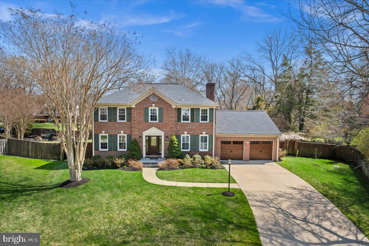 Meticulously maintained and improved classic Colonial style home with one of the most impressive backyard scenes you could ever find! Vacation at home and enjoy the covered rear deck overlooking resort style pool scene. Take your golf cart to the community's fabled amenities including scenic waterfront park that is the setting for many neighborhood gatherings. Recently replaced floating docks (slips with power and water), boat/kayak launch, tennis/pickleball courts, playground, and pond surrounded by open space.  Extensive list of recent improvements include: 900 sq ft "Timber Teck" Deck (2022), Pool/walk way pavers (2022), "Shade tree Bungalow" (2022), Kitchen completely remodeled and expanded  with “Viking” and KitchenAid appliances/Brazilian Granite/White Subway Tile, Spain, Marble, Italy (2018), Custom cabinets made in Ohio, USA, all red oak flooring with natural stain, Gas water heater (2025), both "Lennox" heat pumps and "Lennox" furnaces equipped with humidifier and UV replaced (2024), Roof (30 year transferrable warranty replaced 2016), "Vinyl-Lite" insulated garage doors and "Lift Master" openers replaced (2017), "Vinyl Lite" gutters and leaf guards (2021), "Vinyl Lite" windows and exterior doors (2018 with lifetime transferrable warranty),  "Generac" gas generator (replaced 2021 with 10 year warranty), gas fireplaces (2022), Basement finished (2018), central vac (replaced 2024), Upper level renovated to include hardwood floors, glass handrail, bedroom carpeting, and primary and hall bath fully renovated (2022), "Vinyl Lite" egress window installed in basement bedroom (2021), "Pentair" intelliFlo High performance 3 speed pool pump (2022), "Aiper Scuba" cordless robotic pool cleaner (2025), and the list goes on! Ample parking provided by oversized two car garage, concrete driveway, and quiet cul-de-sac.   Incredibly convenient to everything via the scenic GW Parkway including Old Town, DCA airport, and all Washington DC has to offer. This one of a kind property offers the best of all worlds, classic Colonial combined with striking open and bright interior with unparalleled amenities in one of the area's most desirable communities.