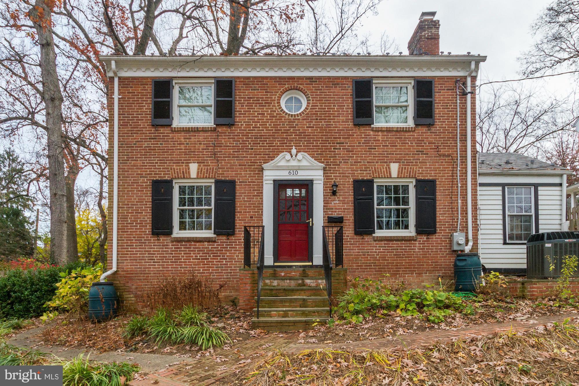 Open house cancelled! Lovely brick colonial high on a hill - Metro, Whole Foods, and more. Three bedrooms up with two full baths, large living room with fireplace with adjoining sun room, dining room, kitchen and half bath on the main level. Partially finished basement with half bath and storage. New windows, newer systems, recently terraced and landscaped yard and 1 car garage
