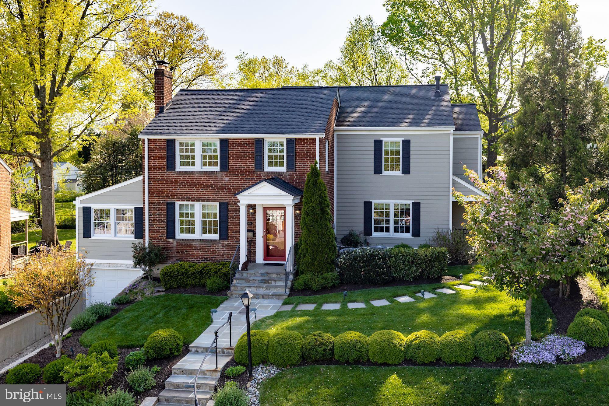 Fully renovated and thoughtfully expanded, this home features beautifully and professionally designed spaces throughout all three levels. The light-filled layout offers crown molding, designer fixtures and hardwood floors throughout. The living room provides a fireplace with a marble surround that leads to both the sunroom and the formal dining room, which gives access to the screened-in porch overlooking the backyard. The beautiful gourmet kitchen features Italian soapstone counters along the perimeter with a marble backsplash, a large center island with marble counters and top-of-the-line appliances including a Wolf six-burner range with a griddle and double-ovens, a SubZero refrigerator/freezer and a Bosch dishwasher. It opens to the family room with built-ins, a gas fireplace and access to the backyard patio. Upstairs, the primary suite includes a sitting room, dual walk-in closets and an elegant primary bath with marble counters and a spa-like shower. There are three additional bedrooms and a full bath on this level. Entirely remodeled in 2017, the lower level offers a recreation room with built-ins and under the staircase nook, a full bath and a storage/utility room that connects to the one-car garage. The fully-fenced backyard features a stone patio, screened-in porch and a sizable lawn. Located in Berkshire Oakwood, it’s a quick walk to Nottingham Elementary School, Tuckahoe Park and East Falls Church Metro, as well as an easy drive to Washington, DC and Tysons.