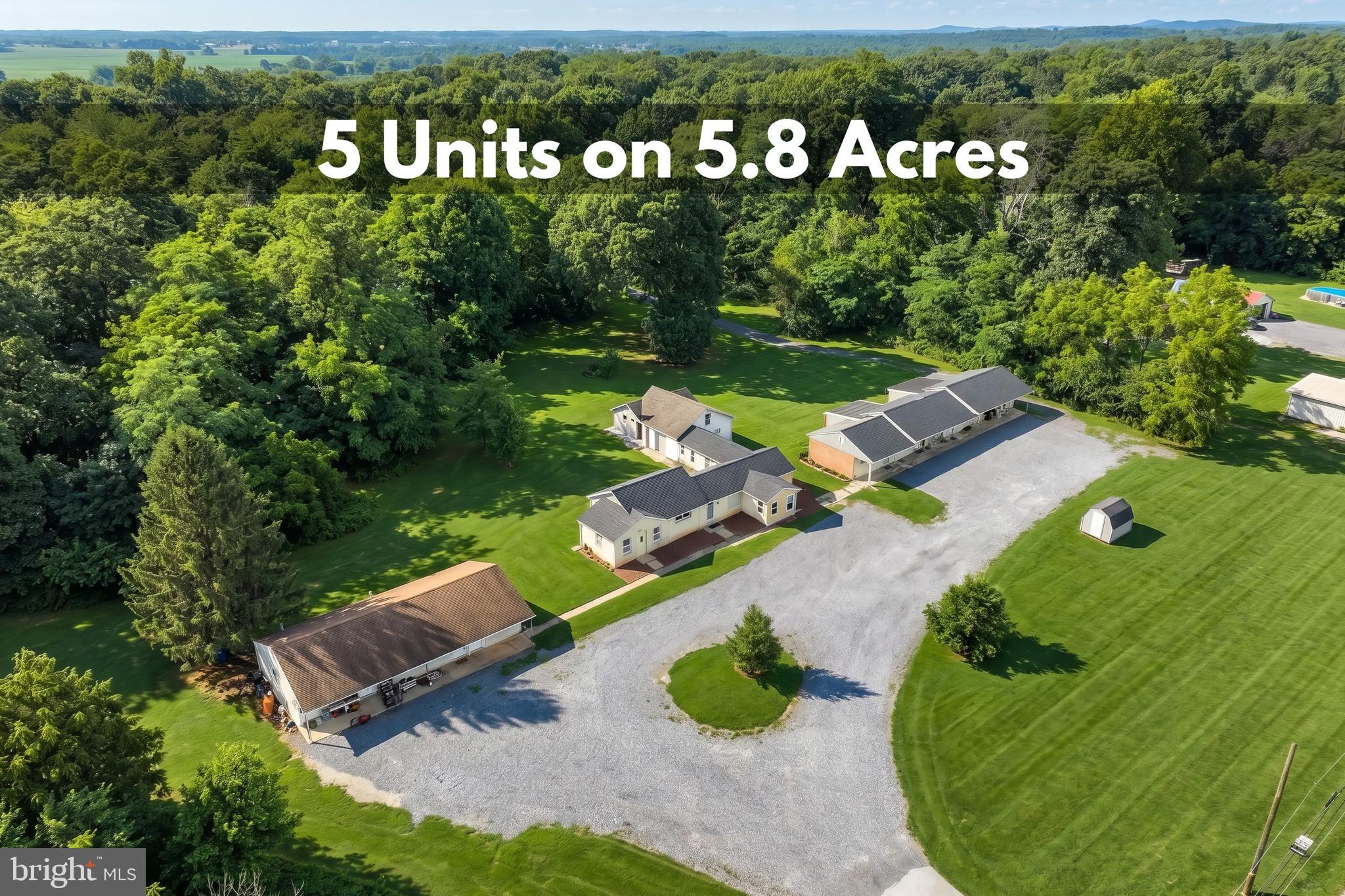 FIVE residential rental units on 5.8 ACRES zoned EC-1 Economic Development Commercial, plus a shared on-site laundry room. Positioned along the highly traveled Route 30 corridor, this unique property offers a combination of existing income potential, acreage, and commercial zoning flexibility. The property also includes a large parking lot and additional storage spaces. This investment opportunity allows buyers to benefit from existing rental income while exploring future development opportunities, subject to zoning approval. Enjoy excellent visibility along Route 30 with convenient access to Route 15 and major highways, creating a strategically located property with strong traffic exposure and accessibility. Zoning information is available in documents. Buyer to verify all square footage, zoning, and permitted uses directly with the appropriate municipal authorities and qualified professionals.***Please do not enter the property or parking lot without a confirmed appointment. Property is occupied and shown by scheduled appointment only.*** This is a rare opportunity to acquire a property offering income potential, acreage, commercial zoning, and a prime location with long-term possibilities. Call today to schedule an appt. to explore the potential this property offers!