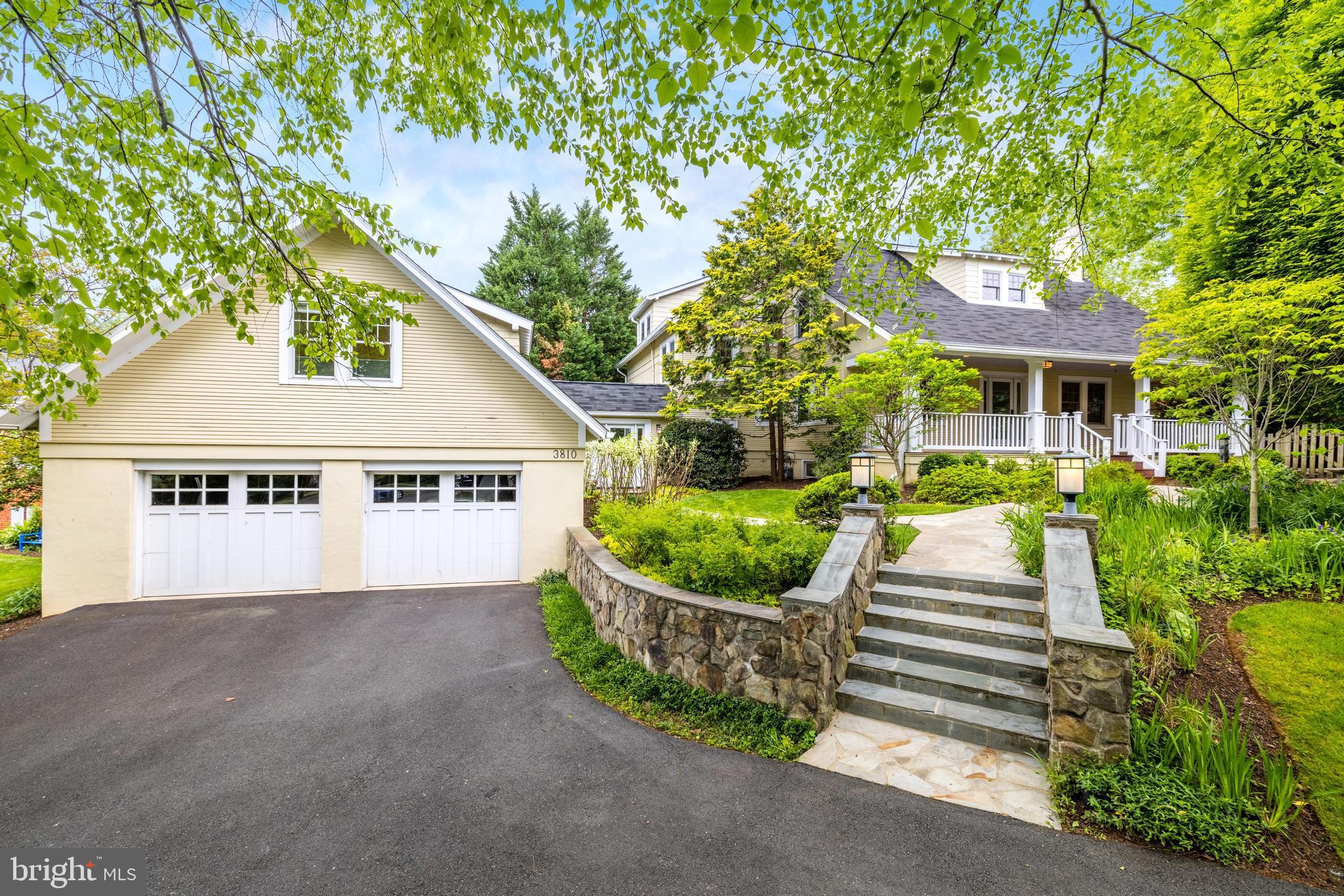 Serene, private, and enviably set on a .36-acre lot, this picture-perfect Arlington residence is one you’ll be proud to call your own. Treat yourself to this beautifully remodeled home’s five bedrooms, four full baths, two half baths, and multiple entertainment areas. Meticulously landscaped grounds line the circular driveway leading to the welcoming covered porch, a peaceful spot to greet the day. Inside, discover a stunning interior crafted with the finest finishes. From the sophisticated palette and elegant millwork to the handsome built-ins and gorgeous hardwood flooring, there’s a lot to love. Stately fireplaces radiate warmth across the living and family rooms, connected by a wet bar butler's pantry with a wine & beverage refrigerator with elegant custom cabinets.
As if straight out of a magazine, the chef’s kitchen is sure to inspire with its top-notch stainless steel appliances, abundant white cabinetry, and gleaming granite countertops extending to additional seating at the peninsula. Exuding comfort and style, the primary retreat has an oversized custom walk-in closet and a luxurious ensuite with a spa-like soaking tub, frameless shower, separate water closet, and dual dressing vanities under a large skylight in a vaulted ceiling.  A convenient suite above the attached 2-car garage is ideal for guests. Outside, imagine leisurely weekends or celebrations in the exceptional backyard surrounded by lush gardens. Other features are the exercise room, recreational area with wine fridges, and main-level office. Washington, D.C., and its wide array of amenities are only moments away. Overall, this one-of-a-kind property in North Arlington is a truly special opportunity for anyone looking for a luxurious and convenient living experience.