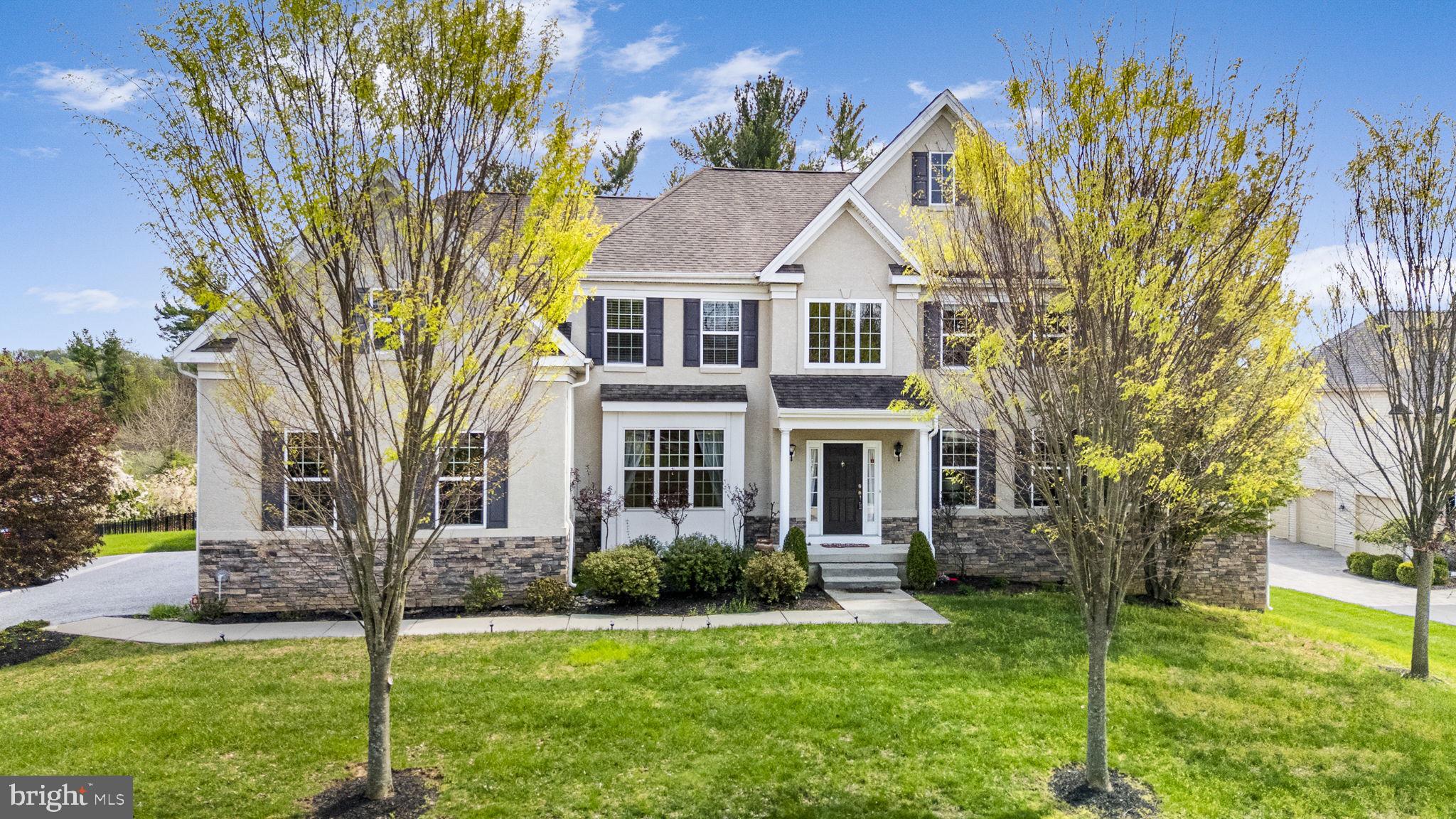 Welcome to an exceptional opportunity in the highly sought-after Chestnut Ridge community, located within the award-winning Downingtown Area School District and the nationally recognized Downingtown STEM Academy. This stunning Colonial-style home combines timeless elegance, modern luxury, and functional design, making it an ideal choice for discerning buyers. Boasting over 0.57 acres of beautifully landscaped property, this 5-bedroom, 3.5-bath residence offers spacious, light-filled interiors with a seamless blend of hardwood flooring and plush carpeting. Designed with both comfort and entertaining in mind, the open-concept layout provides generous living spaces and refined finishes throughout. The kitchen serves as the centerpiece of the home, featuring modern appliances, ample cabinetry, and space perfect for gatherings or everyday dining. The inviting living area, anchored by a charming fireplace, creates a warm and welcoming atmosphere ideal for relaxing or hosting. Upstairs, the expansive primary suite offers a private retreat, complete with a en-suite bath. Three additional, generously sized bedrooms, provide flexibility for family, guests, or home office needs. A convenient main-level laundry room enhances everyday functionality. The oversized side-entry 3-car garage adds both convenience and curb appeal. The basement is spacious and partially finished, with plumbing already roughed in for a future bathroom. The ceiling height has been elevated to support comfortable and practical completion of the space. Outside, enjoy the serene setting with gently sloping open space, perfect for outdoor entertaining, recreation, or simply unwinding in your private backyard oasis. If you’re searching for a home, in a top-rated school district, or a move-in-ready Colonial with premium features, this Chestnut Ridge gem delivers on every level. Schedule your private tour today and experience refined suburban living at its finest.