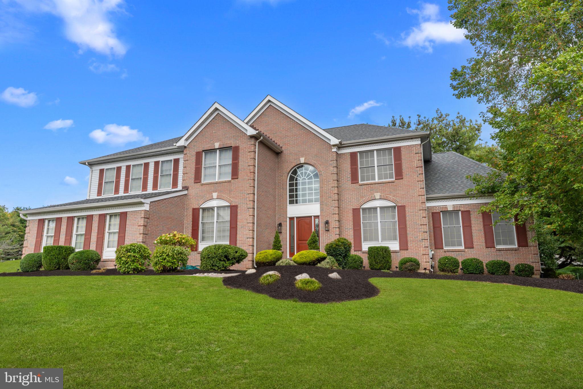 Welcome to this exceptional home nestled in the heart of historic Bucks County, PA. This elegant residence offers 4 bedrooms, 4 full bathrooms, and a powder room, blending timeless design with modern comfort. A grand two-story foyer with classic wainscoting molding sets the tone, leading to a thoughtfully designed open floor plan with hardwood flooring throughout the main level. The formal living room flows seamlessly into the dining room, creating the perfect space for entertaining. A stunning sunroom with walls of windows fills the home with abundant natural light, while maintaining a warm, neutral décor throughout. The main level also features a private study, a beautifully appointed kitchen with a breakfast area, and an impressive two-story great room highlighted by a floor-to-ceiling brick fireplace with propane gas logs. Dual staircases—including a rear staircase from the family room—add both convenience and architectural interest. Upstairs, the spacious primary suite offers a true retreat, complete with a sitting room, two large walk-in closets, and an opulent en-suite bath. Three additional generously sized bedrooms and two full bathrooms complete the second level. The fully finished lower level is designed for entertaining, offering multiple gathering areas, a wine cellar, and an additional full bathroom. Step outside to a picturesque setting featuring a large, maintenance-free rear deck—perfect for relaxing or hosting guests.  Additional highlights include a three-car garage and a stately brick front exterior all majestically set on .92 acres of land. Ideally located close to shopping, dining, and major conveniences, and situated within the award-winning Council Rock School District, this home offers the perfect combination of luxury, location, and lifestyle.
