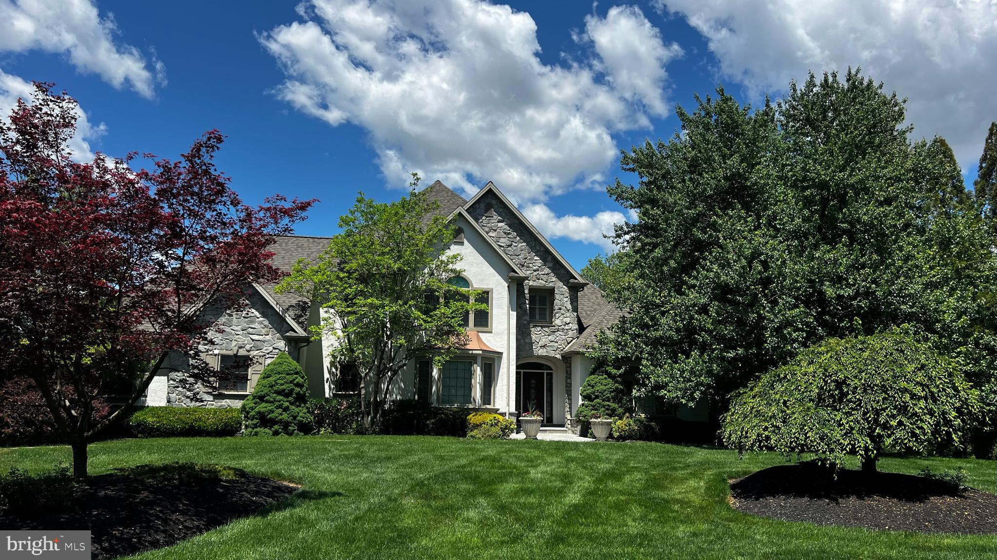 Welcome to 367 Millpond Drive—an exceptional 5-bedroom, 4 full and 1 half bath contemporary home offering over 5,400 square feet of finished living space on a beautifully landscaped 0.84-acre lot in the Millpond neighborhood of Manheim Township. This impressive residence combines expansive living spaces, luxury amenities, and a private backyard retreat. 

Inside, a bright and inviting layout showcases soaring two-story ceilings, elegant architectural details, and spacious gathering spaces throughout. The welcoming foyer opens to a private study and formal dining room. 

The dramatic great room serves as the home's signature gathering space, featuring a gas fireplace, custom built-ins, a soaring two-story ceiling, and expansive windows that fill the room with natural light. 

Continuing the home’s refined feel, the gourmet kitchen is beautifully appointed with granite countertops, a large center island, pantry, and generous cabinetry. Off the kitchen, a second living area with a gas fireplace provides room to relax and entertain, while the adjacent screened porch extends the living space outdoors. Overlooking the backyard and surrounding landscape, the screened porch offers a peaceful setting for morning coffee, evening gatherings, or simply enjoying the natural surroundings. The porch opens to a spacious deck with direct access to the pool area below, making it easy to enjoy the property's exceptional outdoor amenities. 

The main-level primary suite serves as a luxurious private retreat, complete with a walk-in closet with built-ins, and a beautifully appointed en-suite bath featuring a jetted soaking tub, walk-in shower, and abundant vanity space. A mudroom off the attached 3-car garage and main-floor laundry room completes the first floor. 

Upstairs, three bedrooms provide comfortable accommodations for family and guests, including one with a large walk-in closet and private full bath. 

The fully finished lower level expands the home’s versatility and entertaining potential. It features a spacious rec/game room, dedicated exercise room, bedroom, full bath, wine cellar, and a flexible bonus space with a pantry, refrigerator, and sink. Extensive built-ins, a cedar-lined storage closet, and abundant storage closets provide plenty of functionality and organization. Enjoy direct walkout access to the patio and pool area. Whether used for recreation, fitness, hobbies, entertaining, or guest accommodations, this level offers endless possibilities. 

Outdoor living is equally impressive. The fenced pool area features expansive patios and space for seating and entertaining, an inground pool with hot tub, mature landscaping, and attractive hardscaping. Backing to a public pond and creek, the property enjoys a tranquil setting with privacy and a natural backdrop ideal for relaxation, recreation, and entertaining. 

Additional highlights include a whole-home sound system, exceptional storage, and a prime location convenient to Manheim Township schools, shopping, dining, parks, and major commuter routes. Schedule your private showing today.